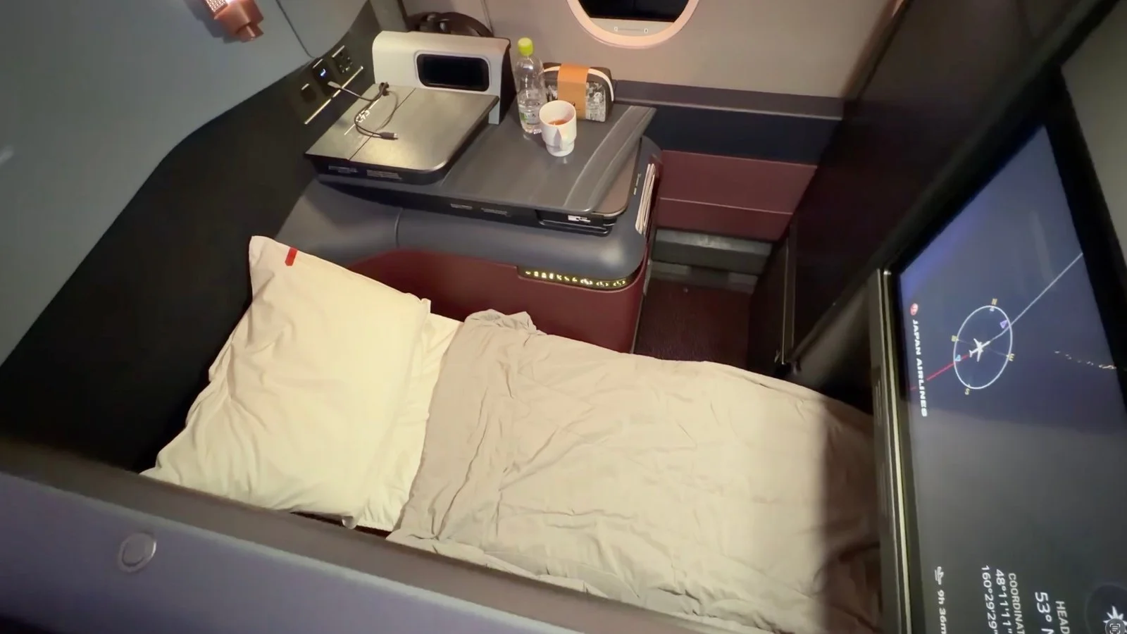japan-airlines-a350-1000-business-class-seat-bed-with-flight-map