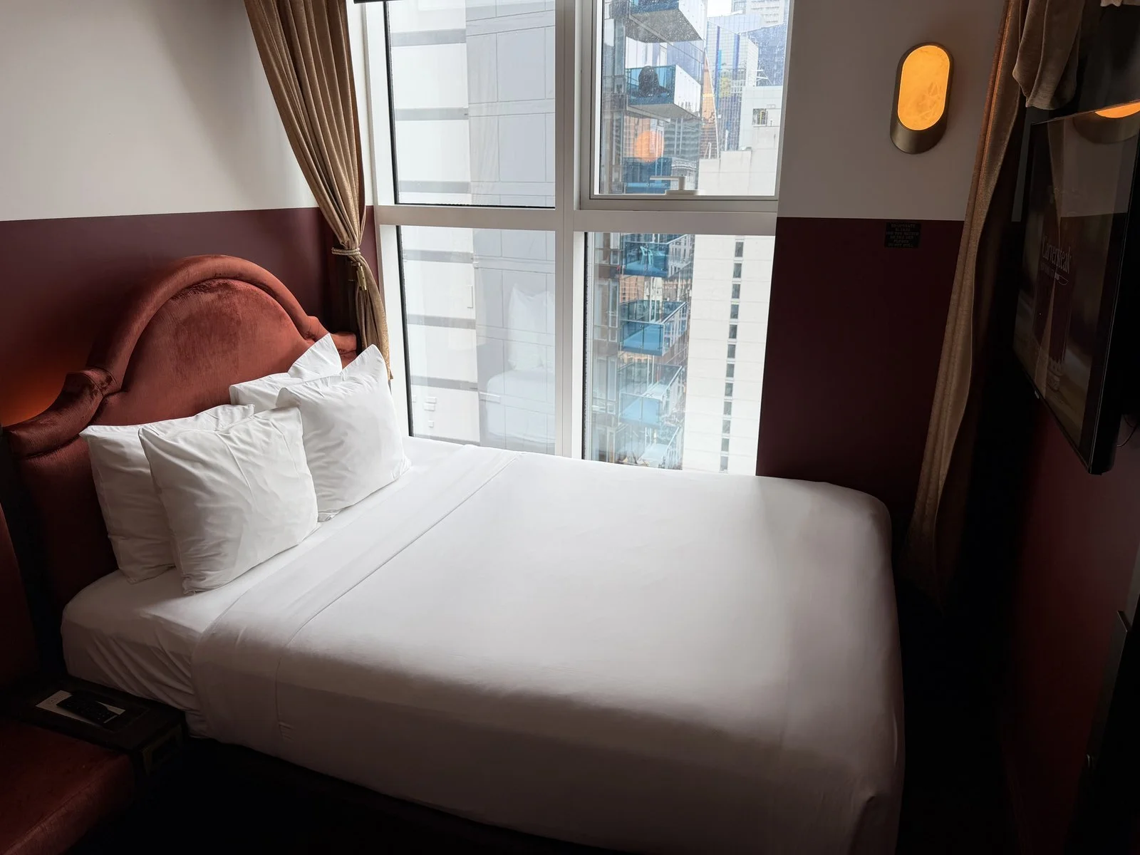 civilian-hotel-new-york-cozy-queen-room-bed-window-view-b