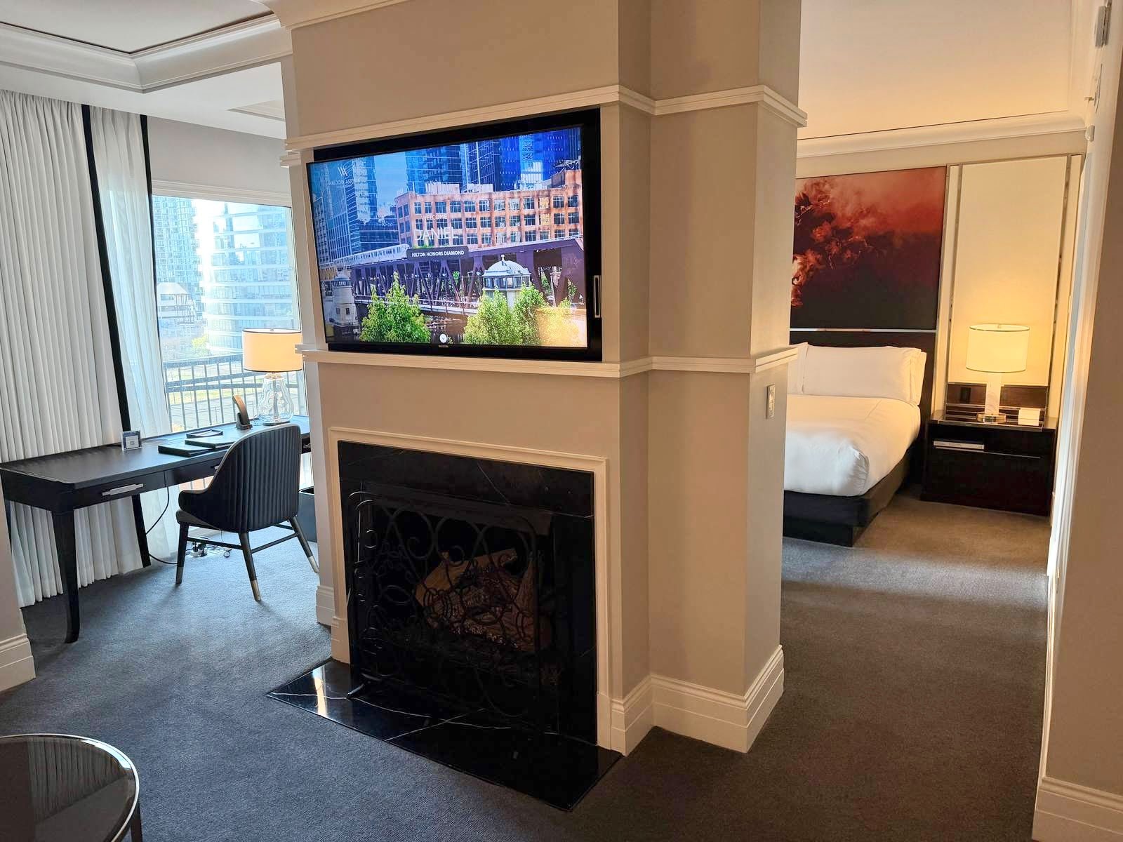 waldorf-astoria-chicago-junior-suite-fireplace-tv-welcome-screen.jpeg