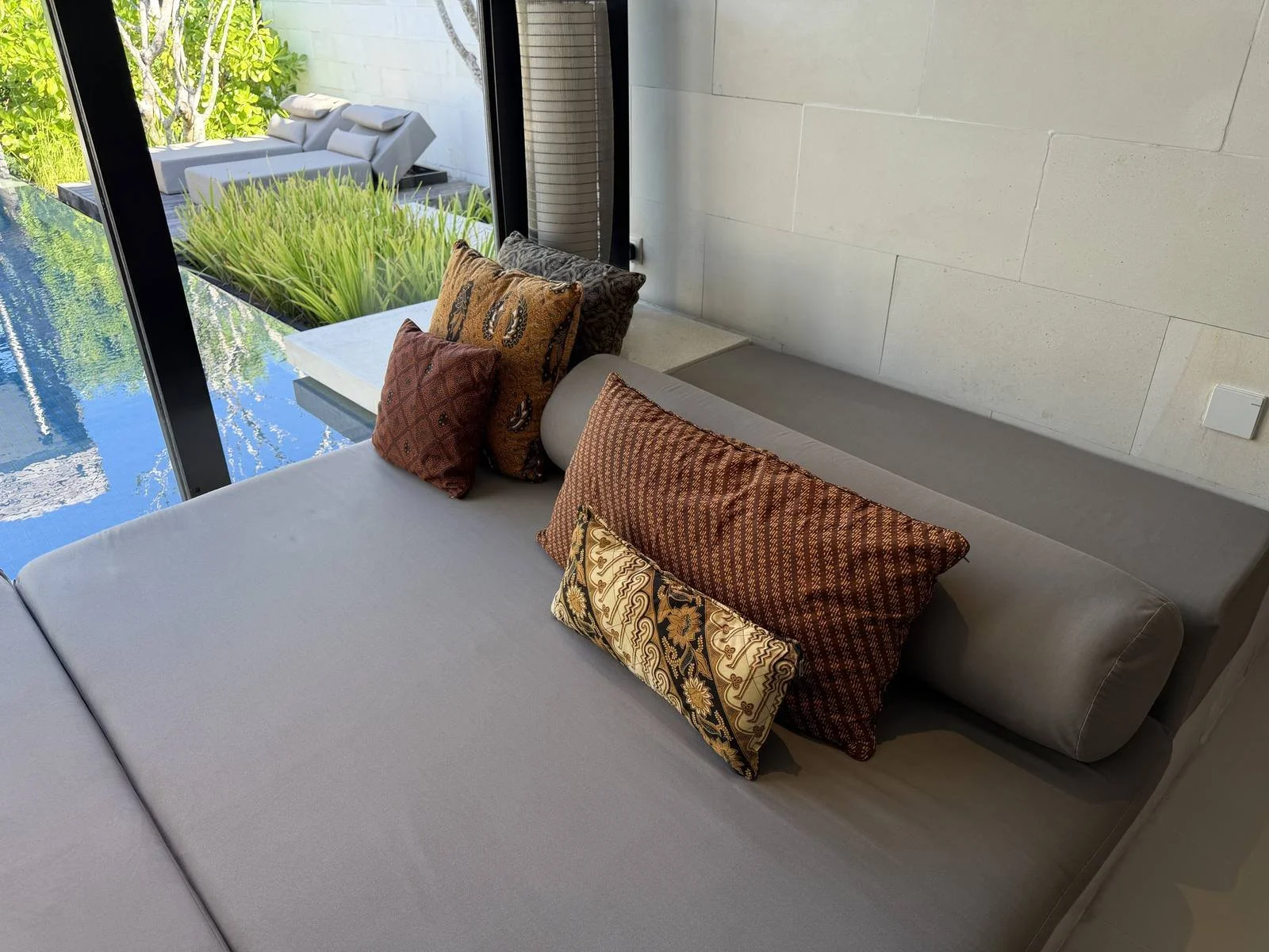 alila-villas-uluwatu-villa-daybed-batik-cushions-pool-view.jpg
