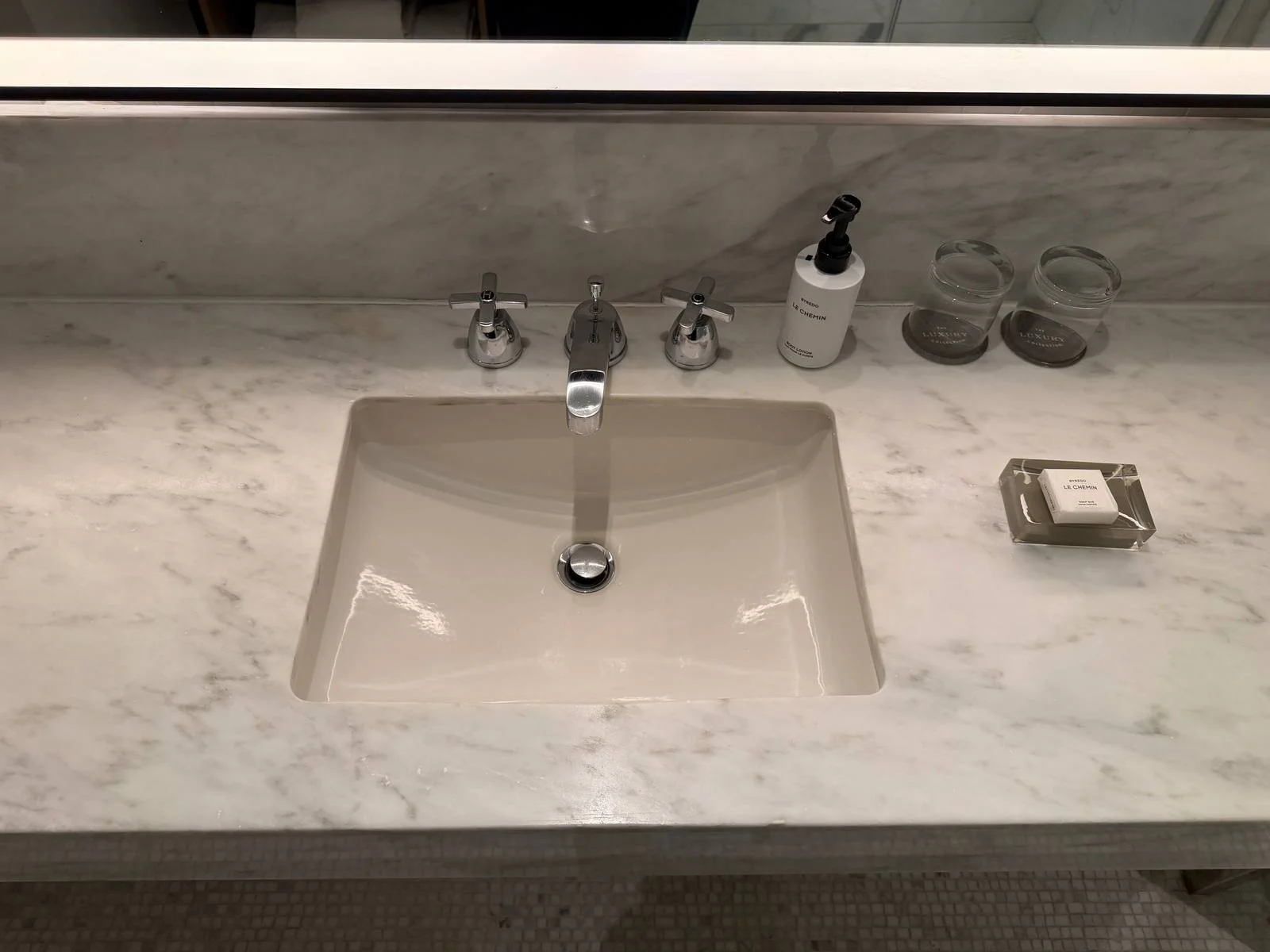 the-london-nyc-one-bedroom-suite-bathroom-vanity-byredo-amenities