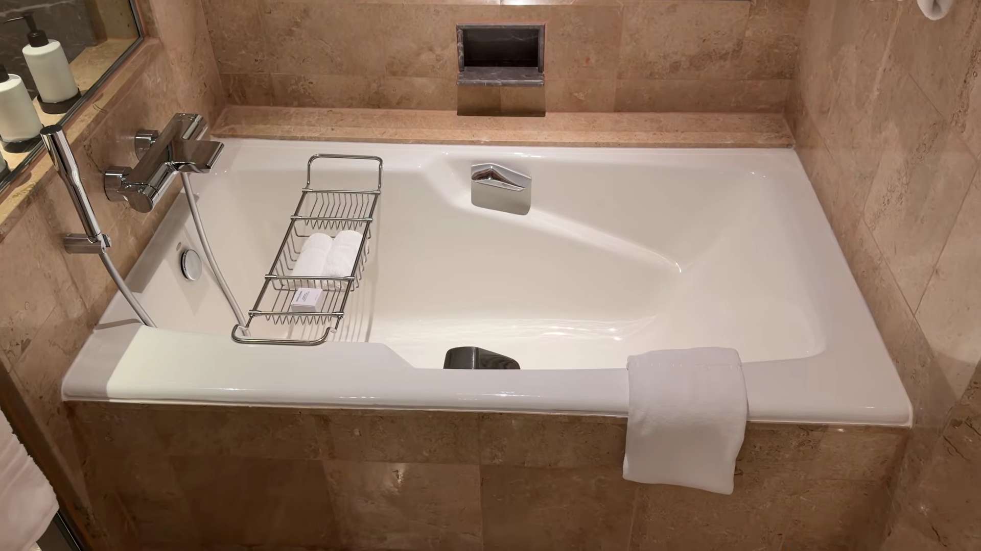 Four Seasons Singapore large bathtub with armrests