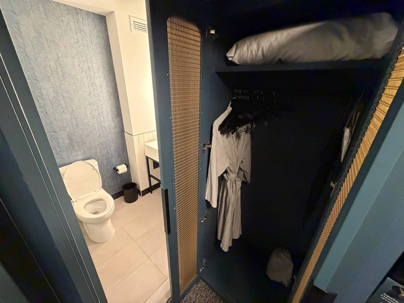 kimpton-theta-new-york-corner-king-room-closet-robe-bathroom-view