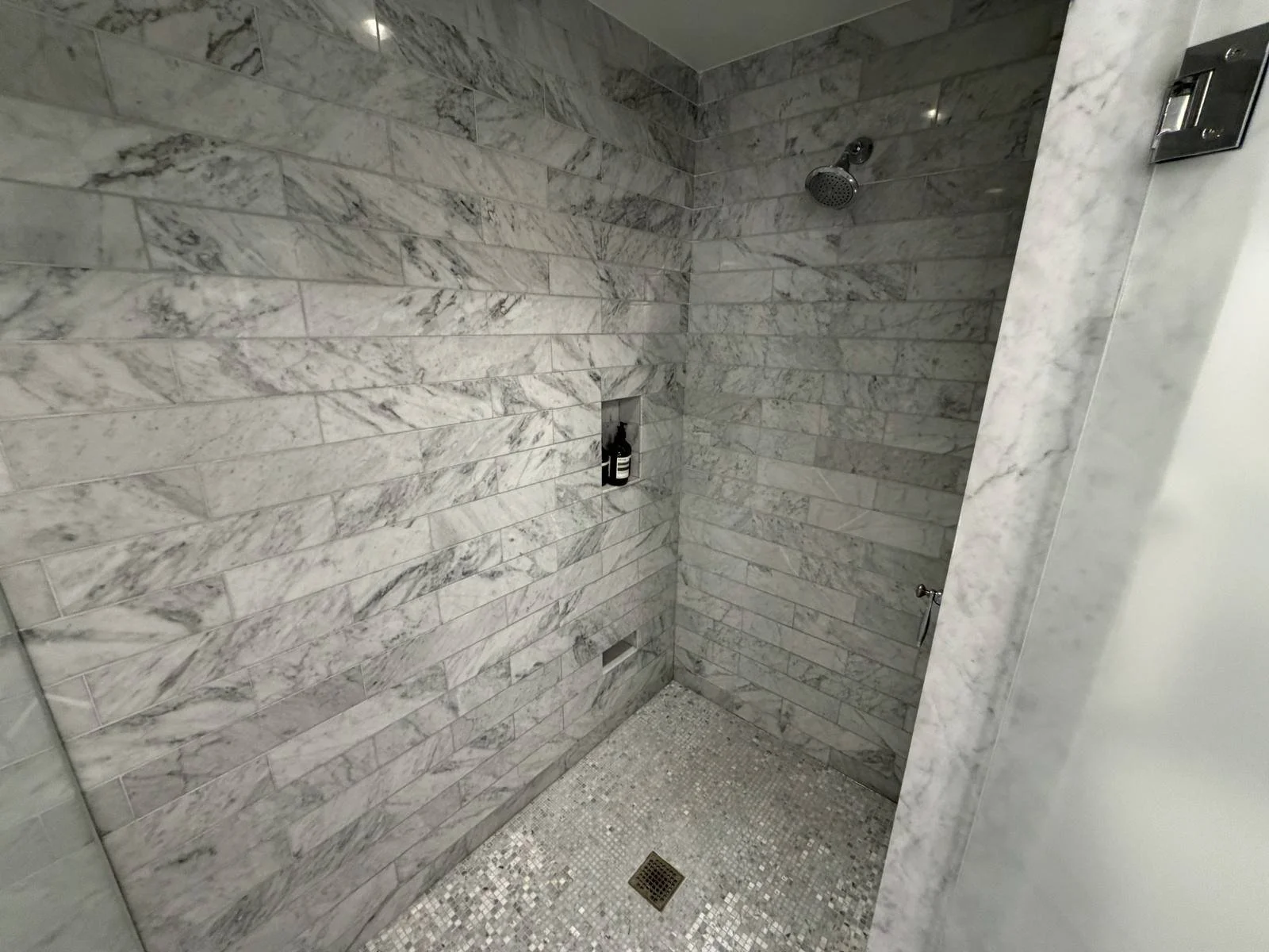 waldorf-astoria-chicago-junior-suite-walk-in-shower-marble-tile.jpg