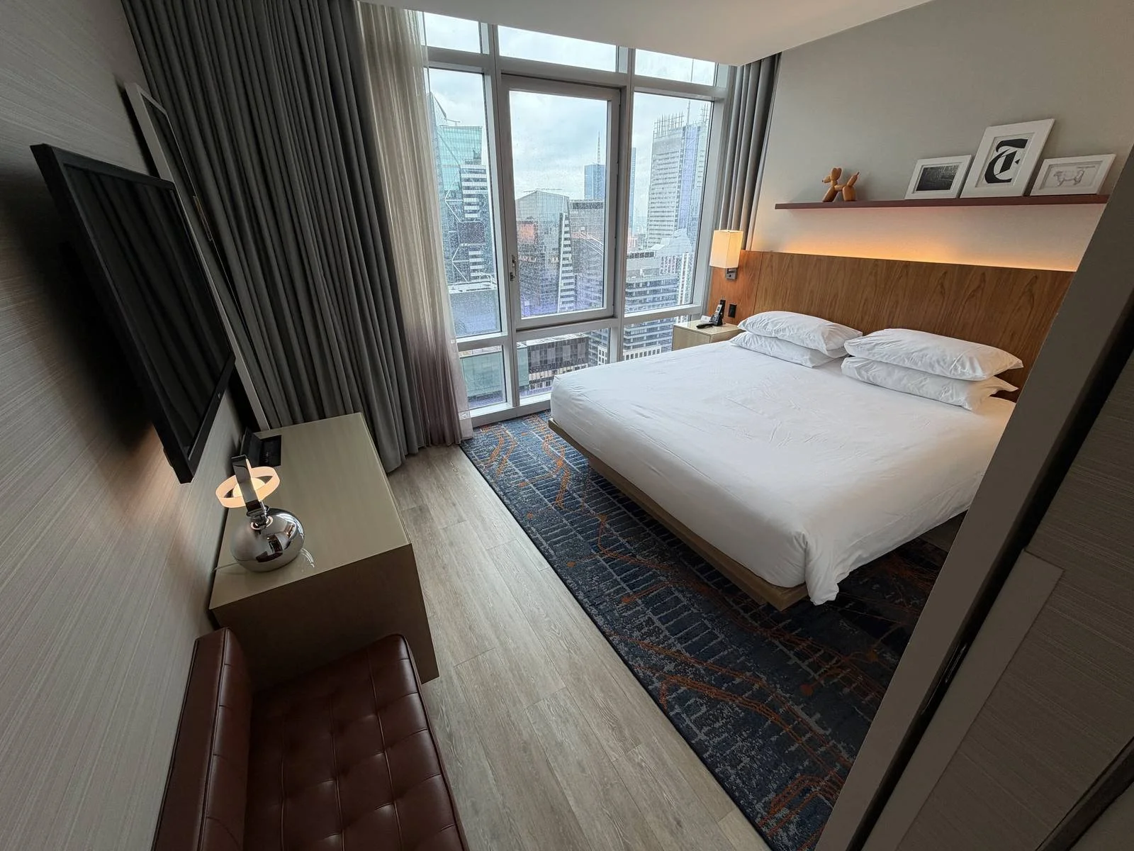 hyatt-centric-times-square-times-square-view-suite-bedroom-wide-angle-tv.jpg