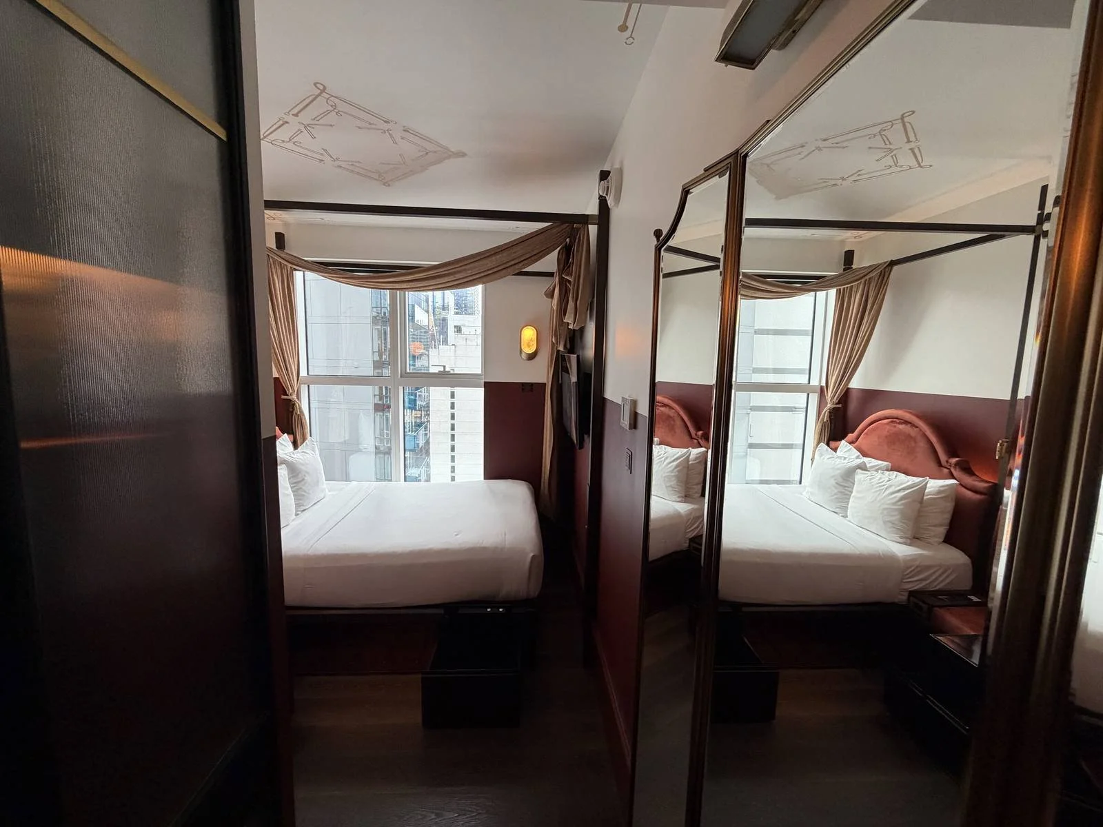 civilian-hotel-new-york-cozy-queen-room-bed-mirror-reflection