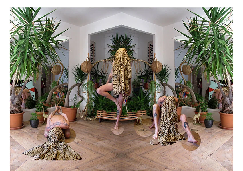 Person performing yoga poses surrounded by indoor plants and mirrors, draped in leopard-print fabric.