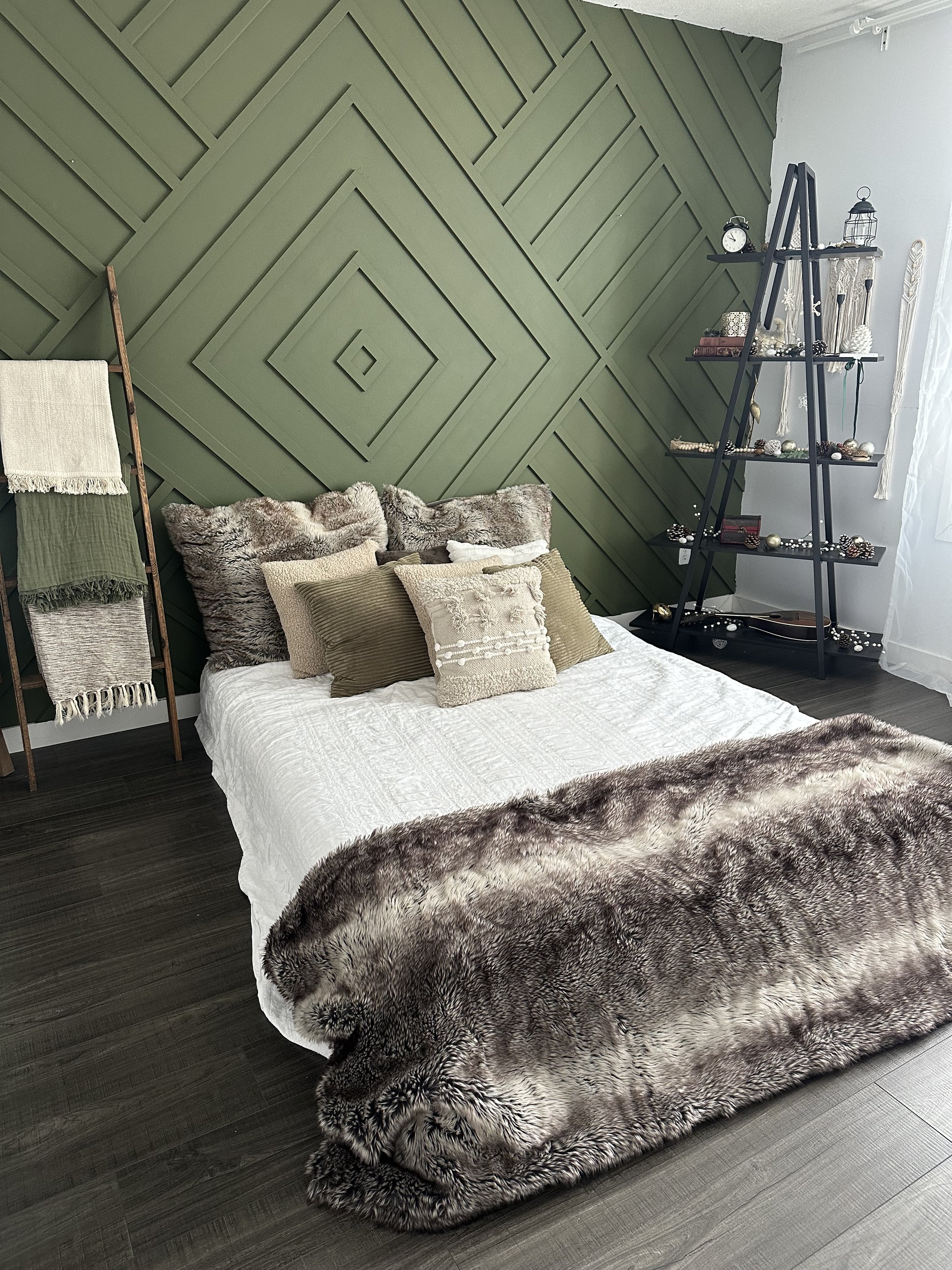 Edmonton photoshoot set with a cozy bed, stylish armchair, and plenty of natural light for photographers.