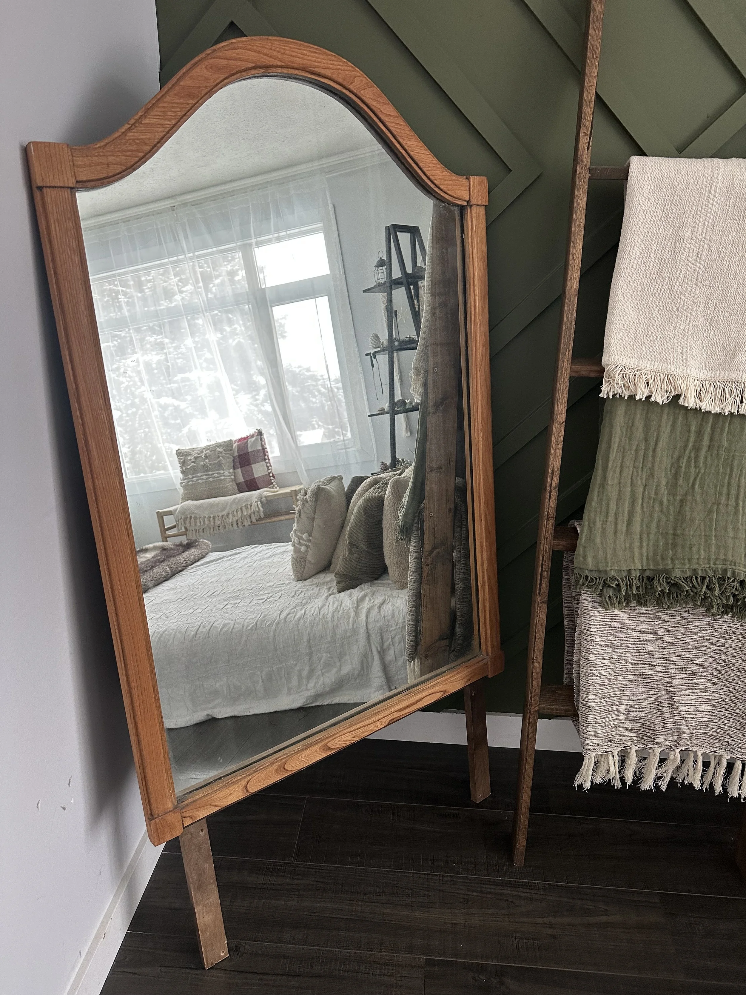 Inviting Edmonton photoshoot set with cozy bed, reading corner, and bright natural light for photographers.