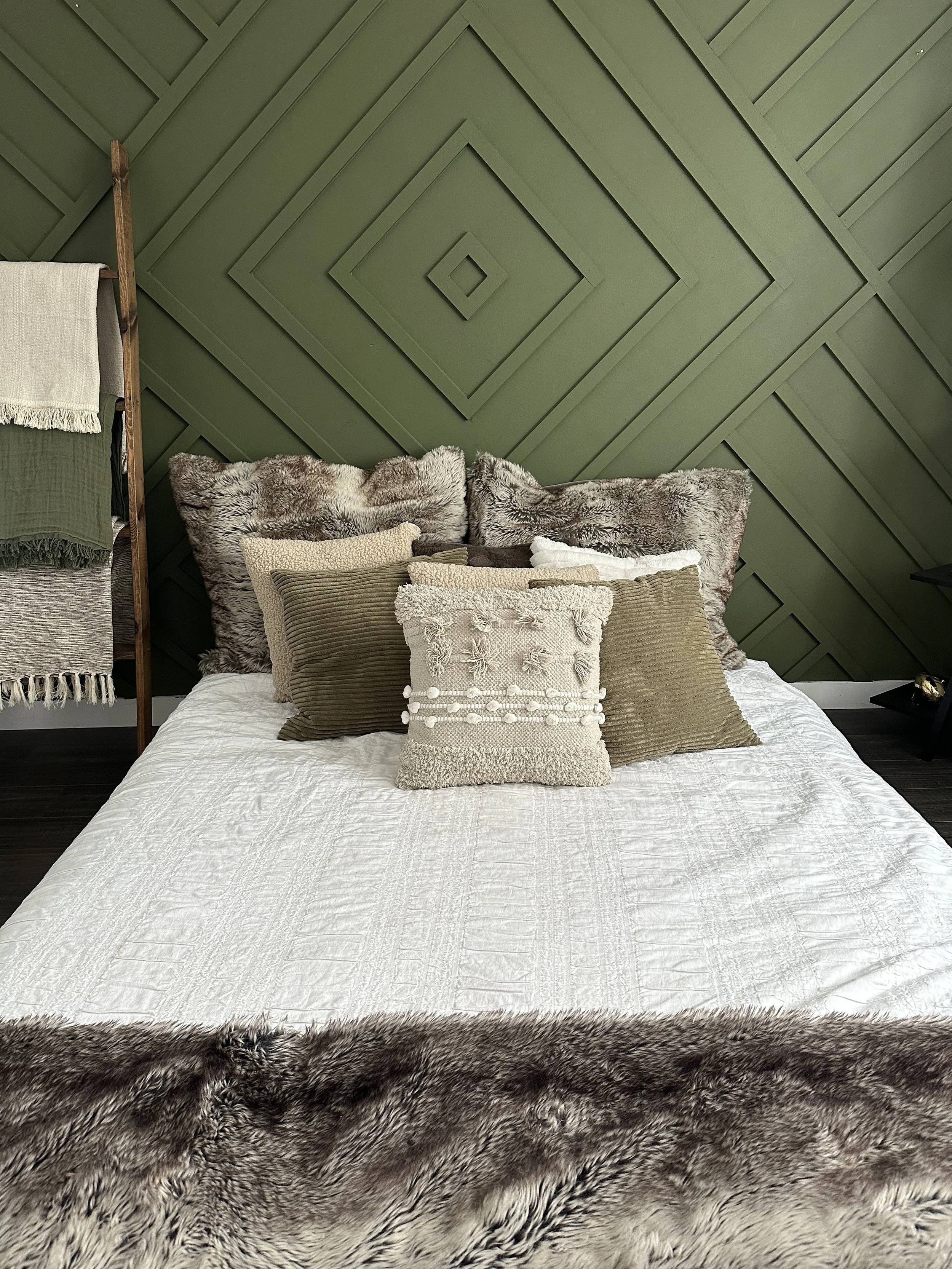 Cozy bedroom set in Edmonton, perfect for photographer photoshoots with soft bedding and natural light.