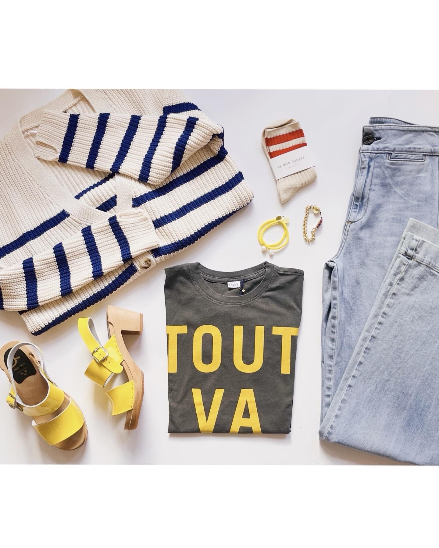 I made a little outfit mood board for you. Clare V &ldquo;Tout Va Bien&rdquo; tee back in stock 💛. Paired here with our striped cotton oversized sweater, and @askkny jeans. All in store now even the yellow clogs, @lebonshoppe socks and bracelets #to