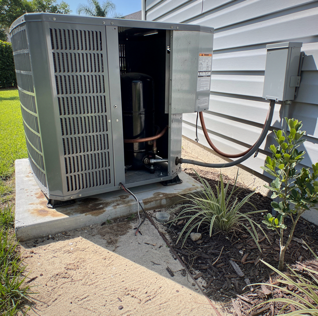 air conditioner compressor unit on brick wall