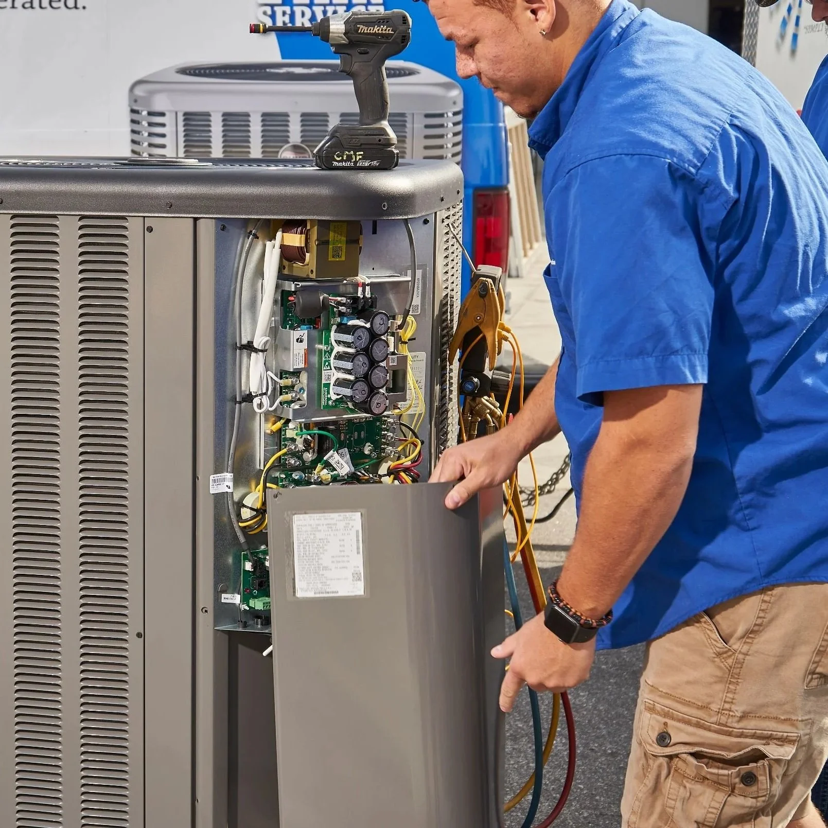 HVAC technician using mechanical brushes and vacuum equipment to remove dust and debris from residential air duct systems in Tampa.