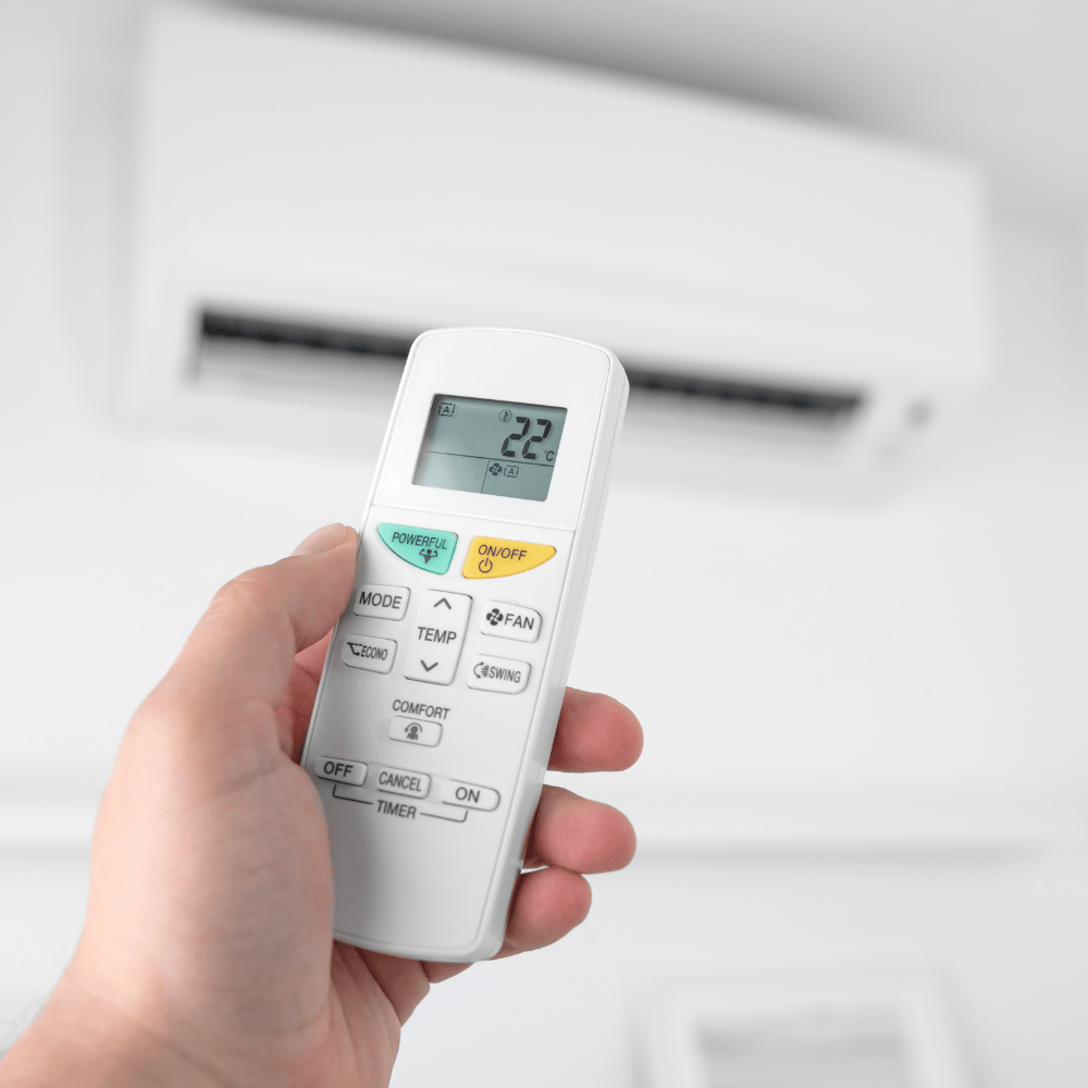 Technician inspecting home ductwork and AC components in a Tampa attic to prepare for efficient new air conditioning installation.