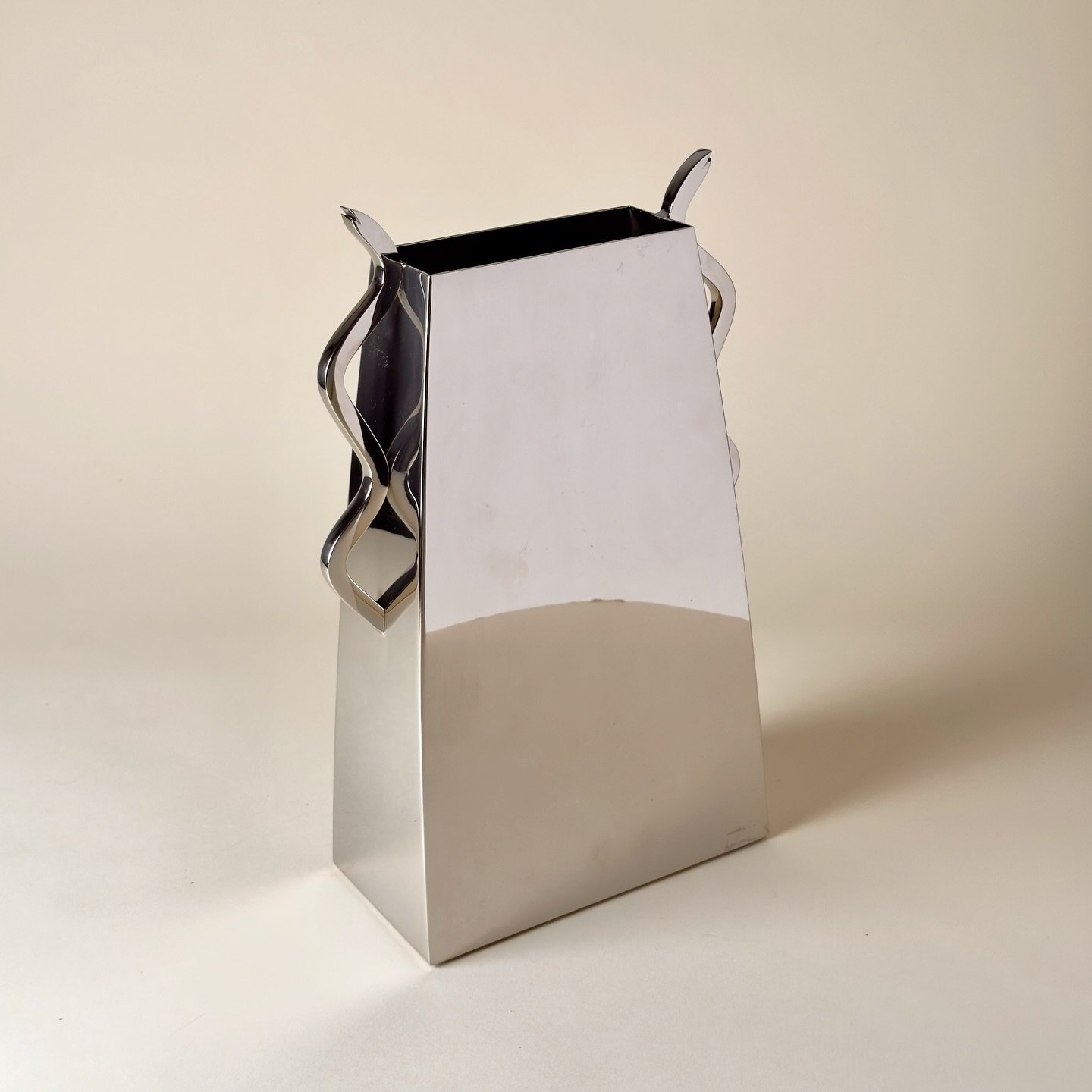 &lsquo;Serpent&rsquo; vase designed by Stanley Jay Friedman for Brueton, a prolific American furniture company who made a limited series of large scale vases outside of their iconic furniture. Chromed steel, 1980s.

Measures: 13&rdquo; x 8.5&rdquo; x