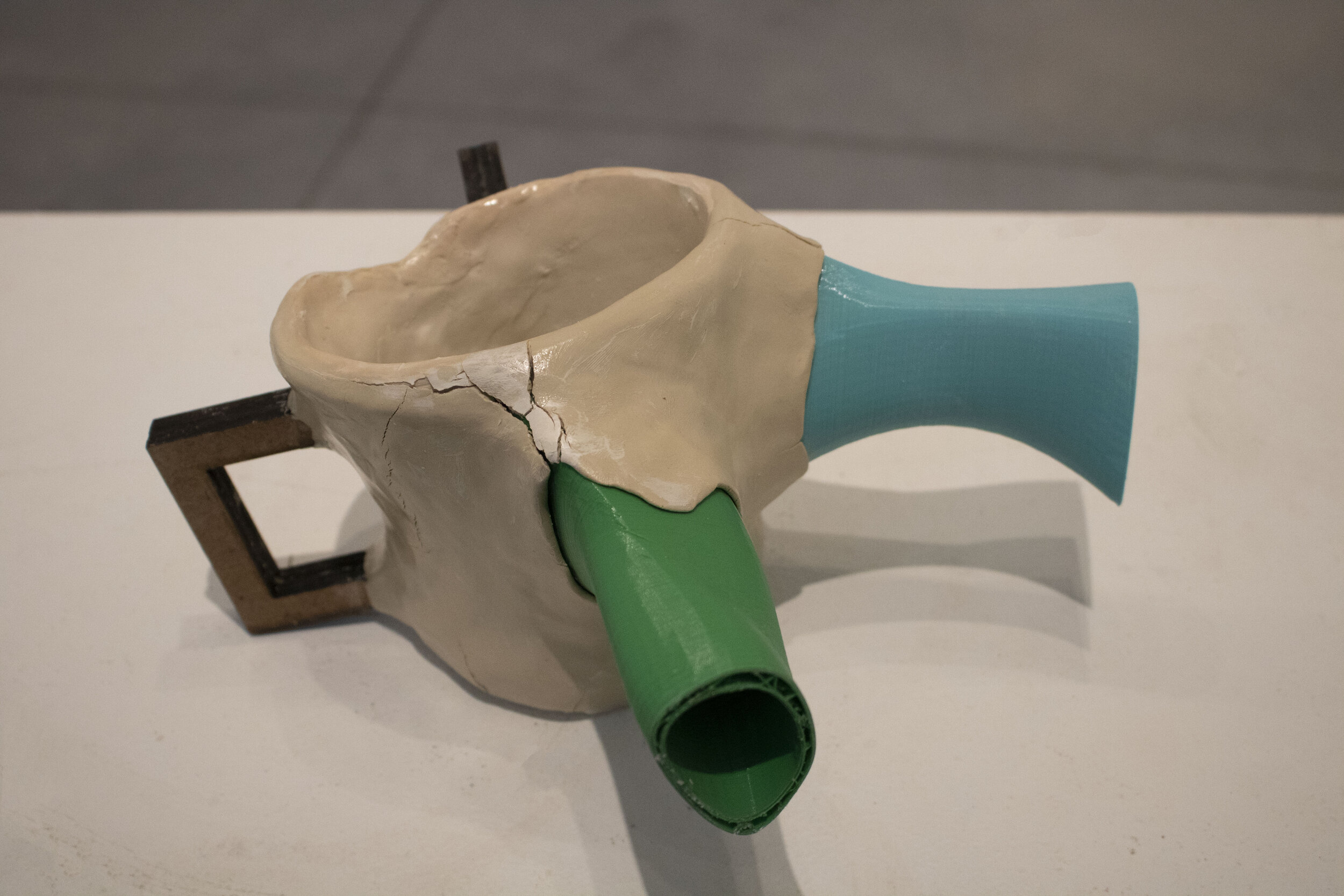 Satirical Watering Can: 5” x 4” x 7”; Oven bake clay, air dry clay, 3D printed spots, laser cut handles; February 2020;
This product was inspired by the red solo cup I use to water my plants in my living room. The solo cup is not an ideal instrument