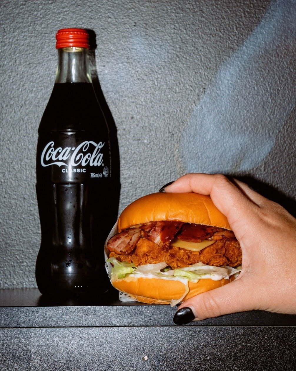 Picture this: you've just sunk your teeth into the perfect Butch Cassidy bite - juicy, flavourful, and oh-so-satisfying. But as good as that first bite is, you know there's something missing... that perfect companion to wash it all down.

Enter Coke 