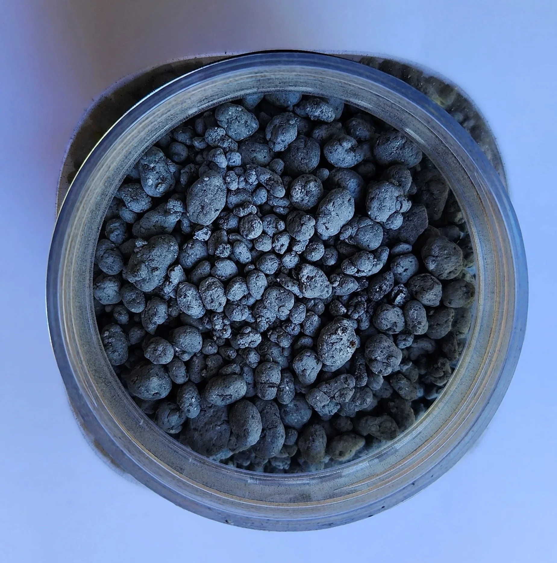 a jar of Terix Biochar granules