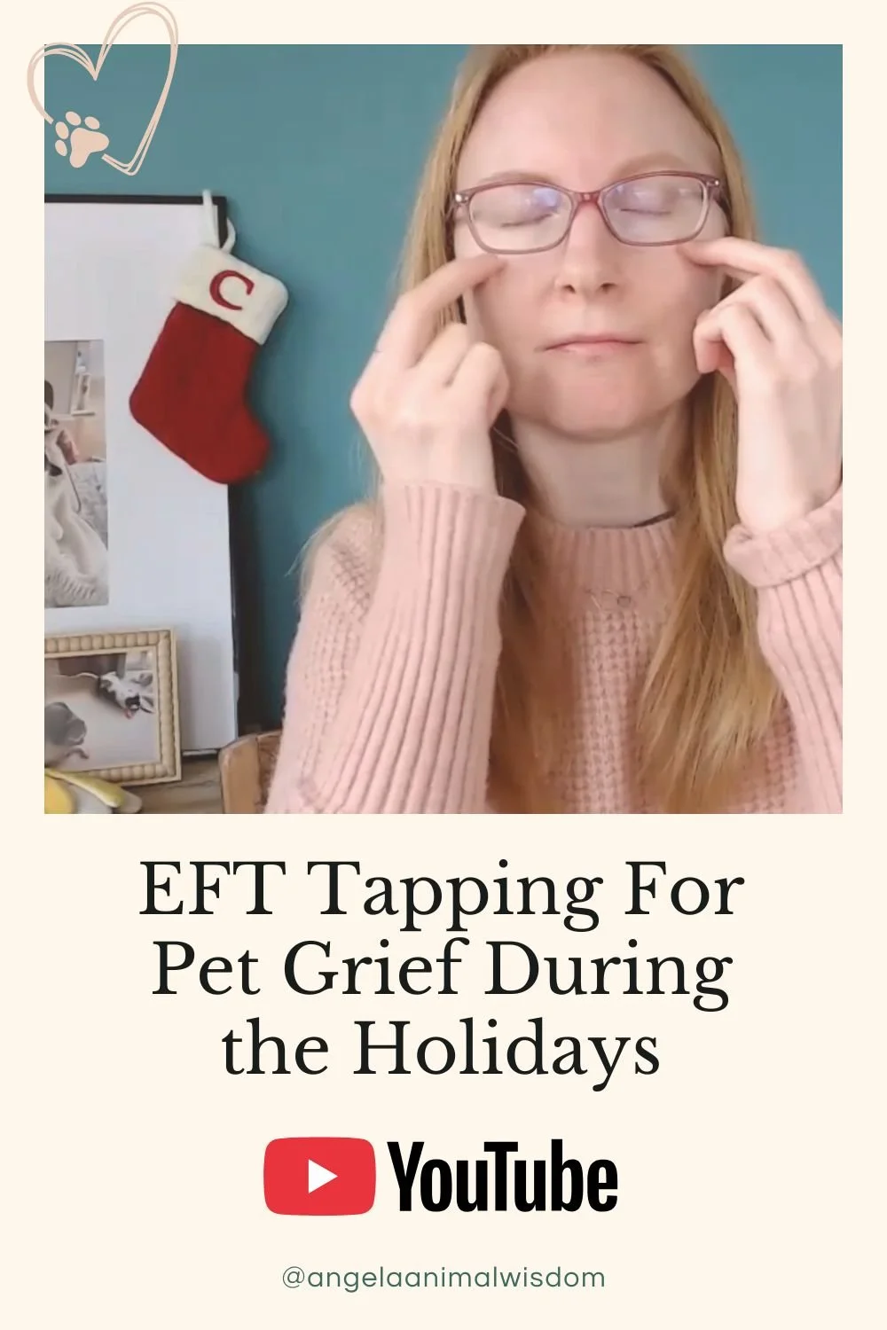 A woman named Angela, is showing herself doing EFT tapping during a video made to support pet parents with grief during the holidays.