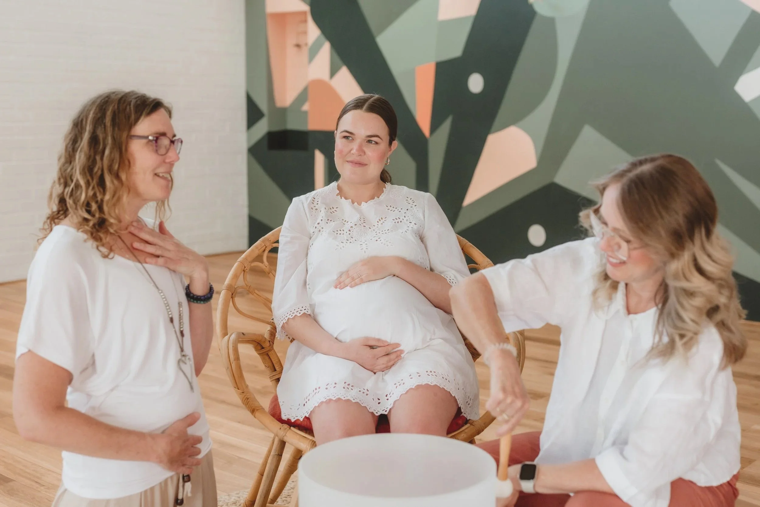 Nicole Lloyd guiding a private SoundBirth session with pregnant woman and support person