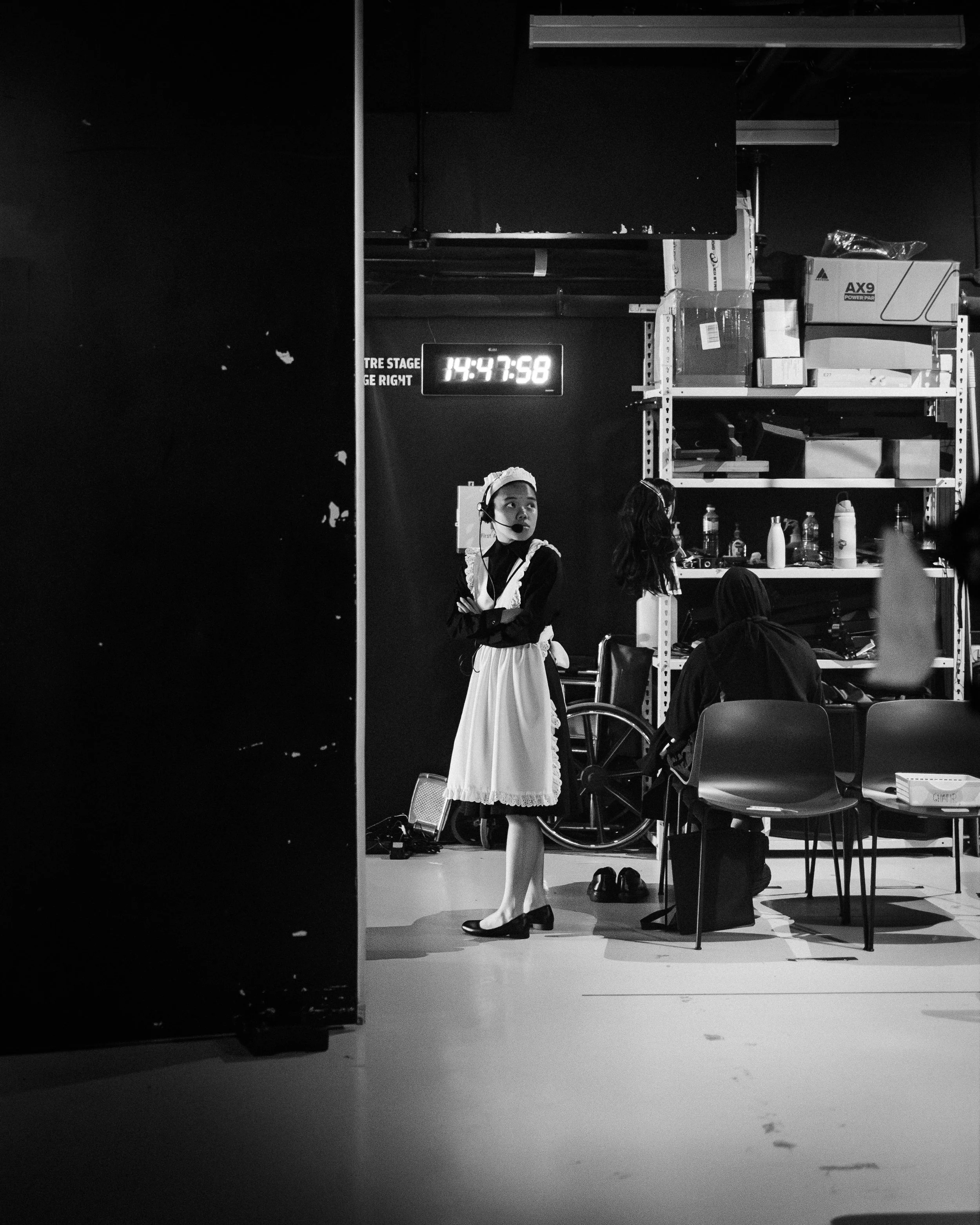 Assistant Stage Manager Goh Xin Yi backstage, dressed in Chambermaid costume for Part 1.