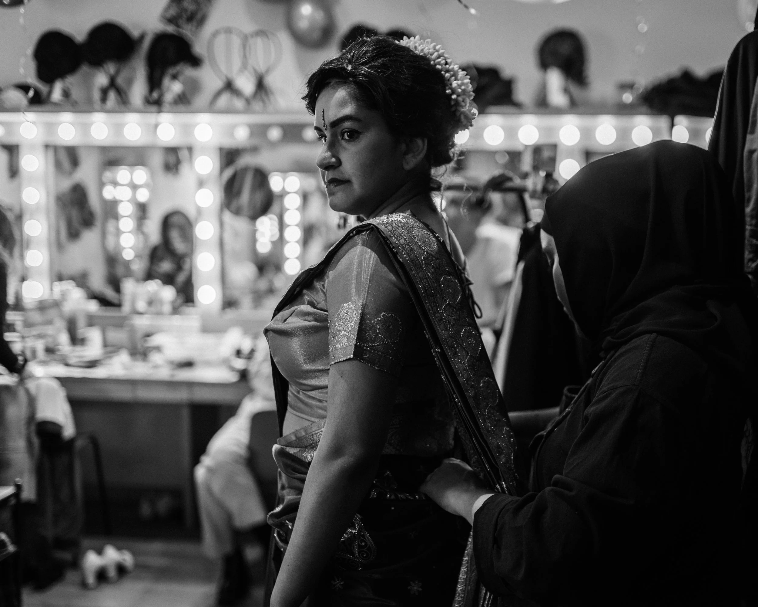 Sindhura Kalidas in the dressing room, getting dressed in her sari to play Mdm. Vani from Scene 1995.