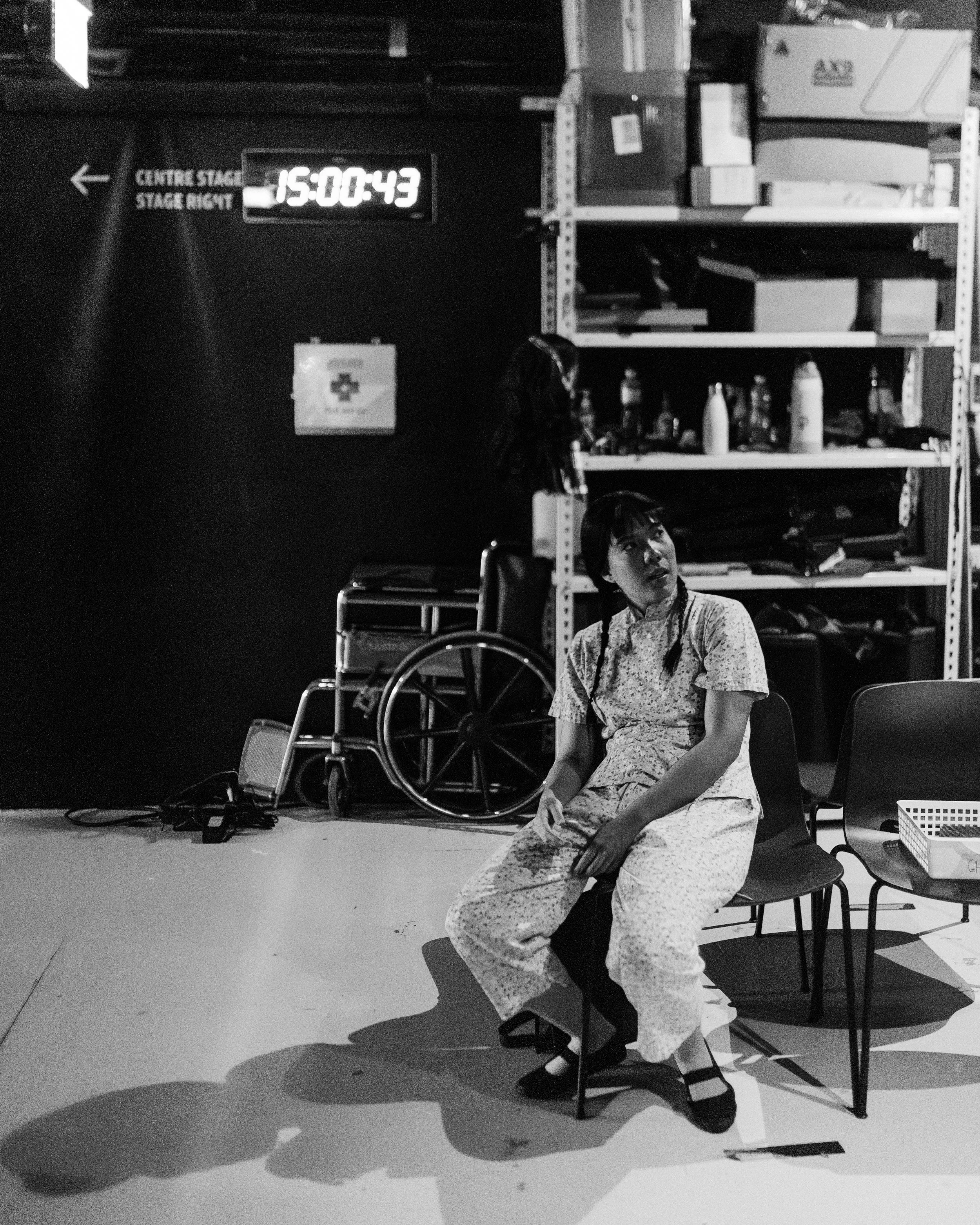 Yap Yi Kai waits backstage dressed as her character Ah Ying from Scene 1925.