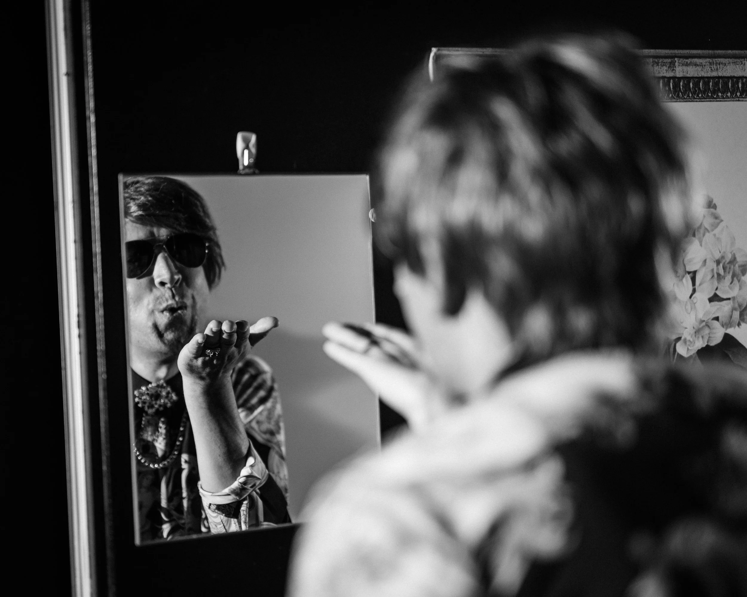 Ghafir Akbar blowing himself in the mirror backstage before going on as Wan in Scene 1995.