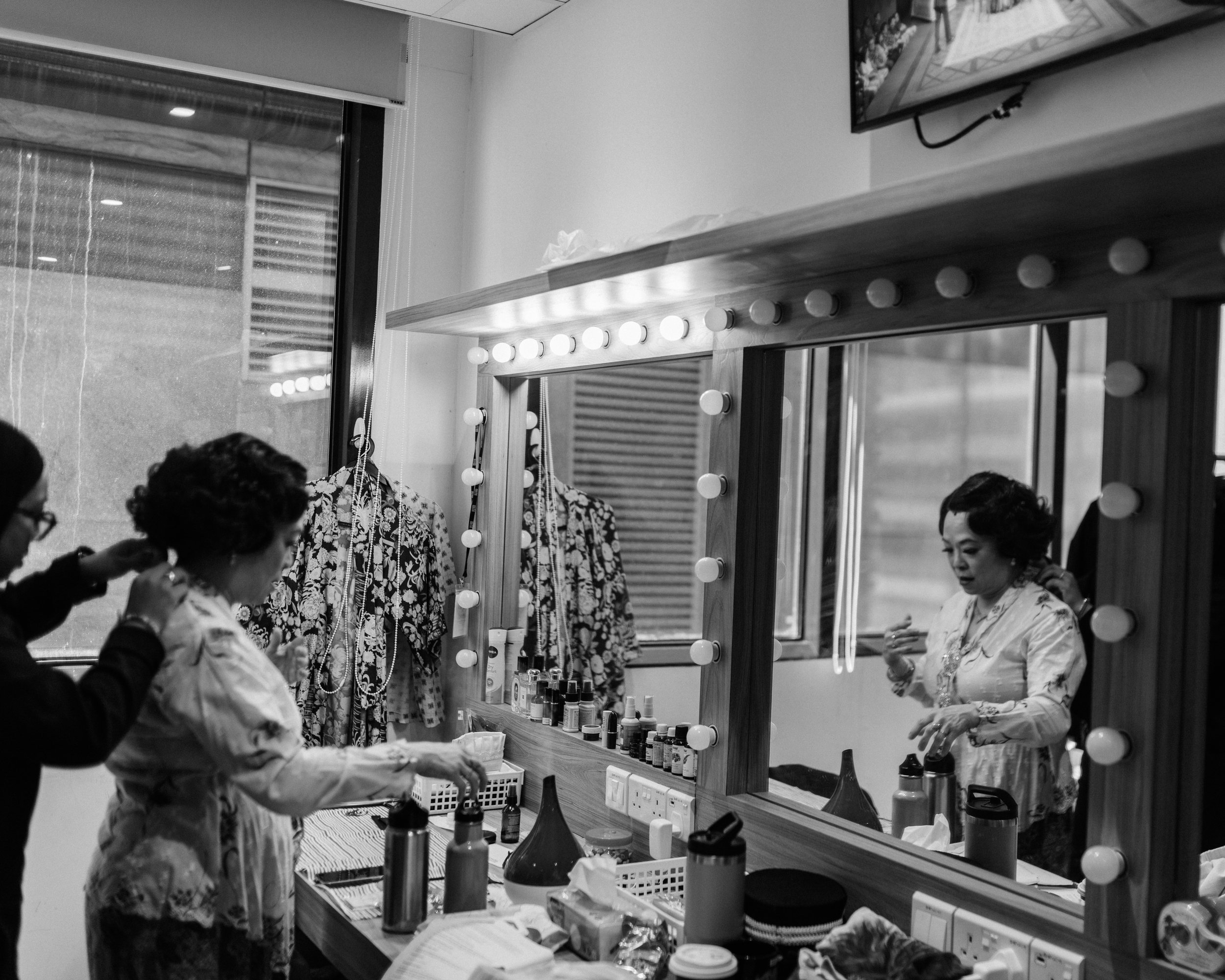 Pam Oei in the dressing room, getting ready to play Choo Neo, from Scene 1935.