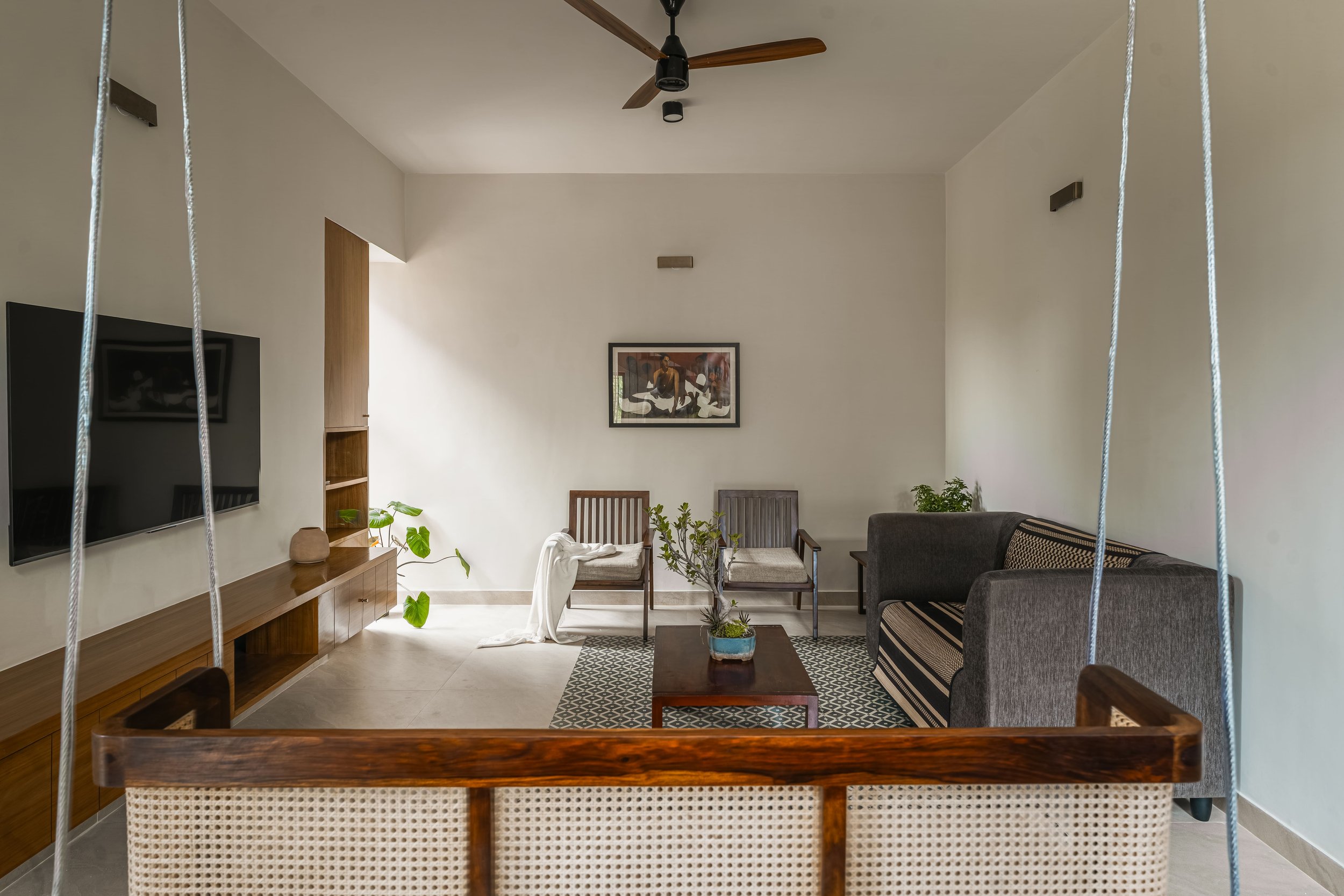 The living room, opened wide toward the balcony