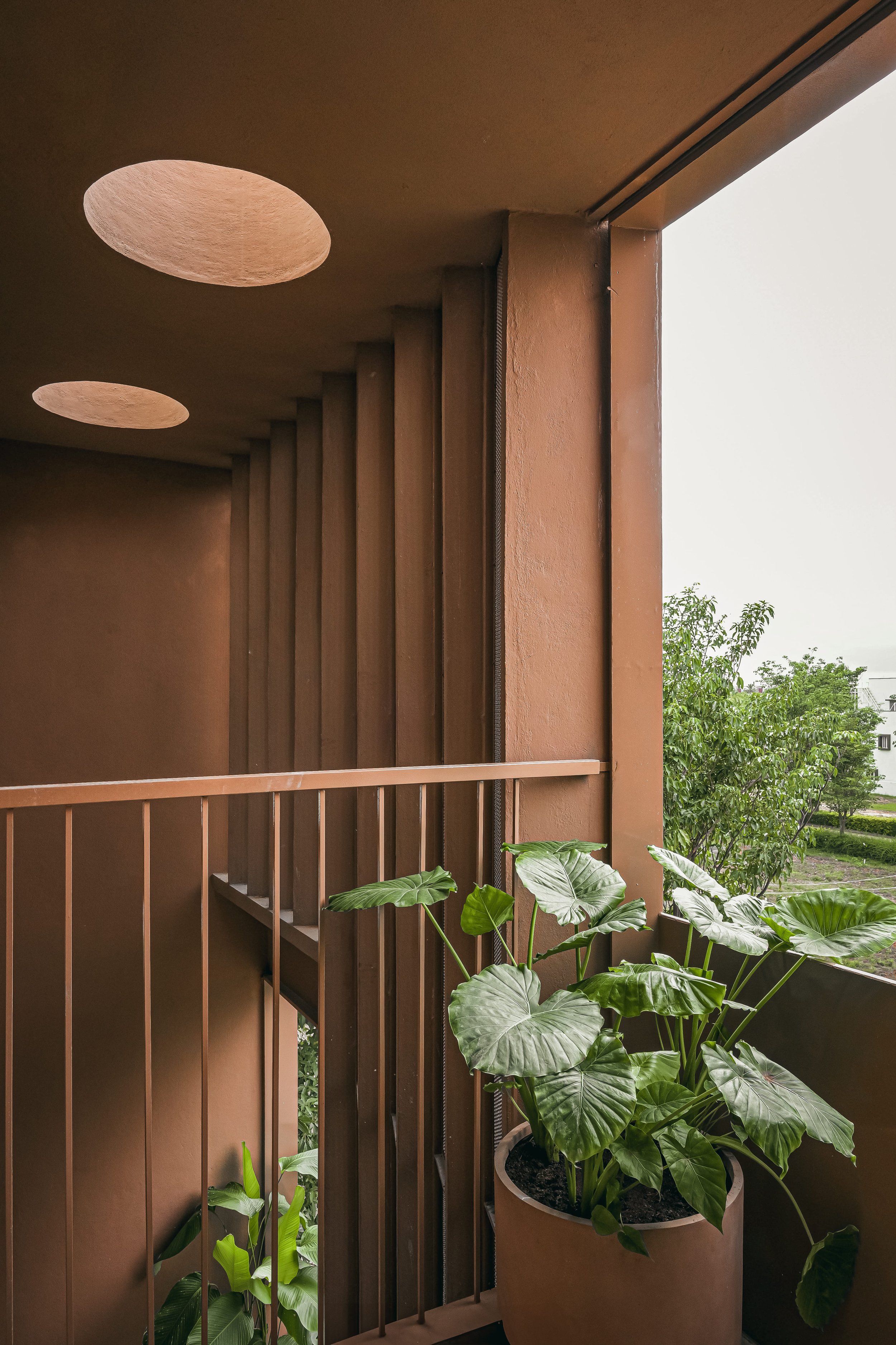 Balcony with planting under the round skylights