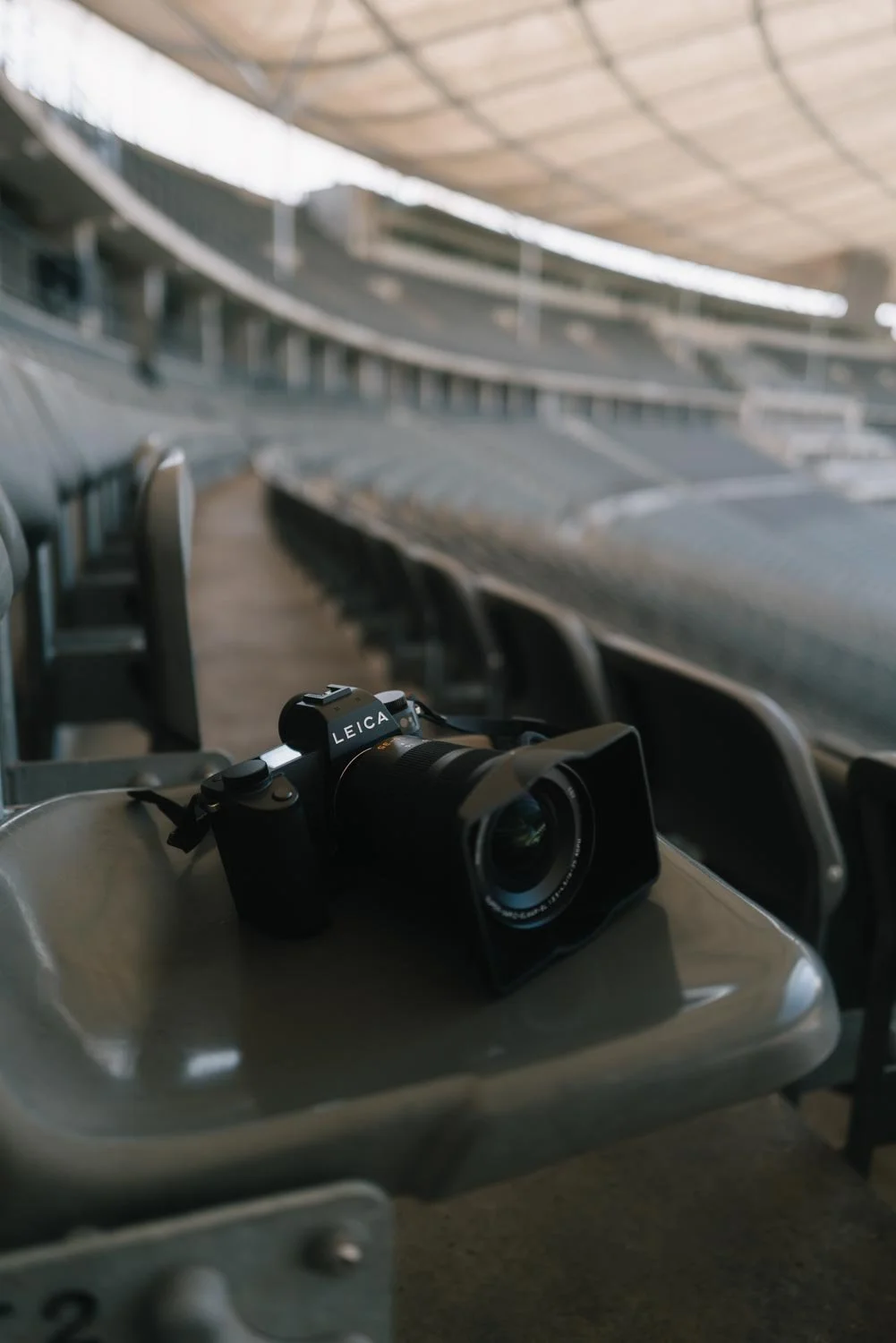 Leica SL 3 P photographed on a chair in Olympiastadion Berlin