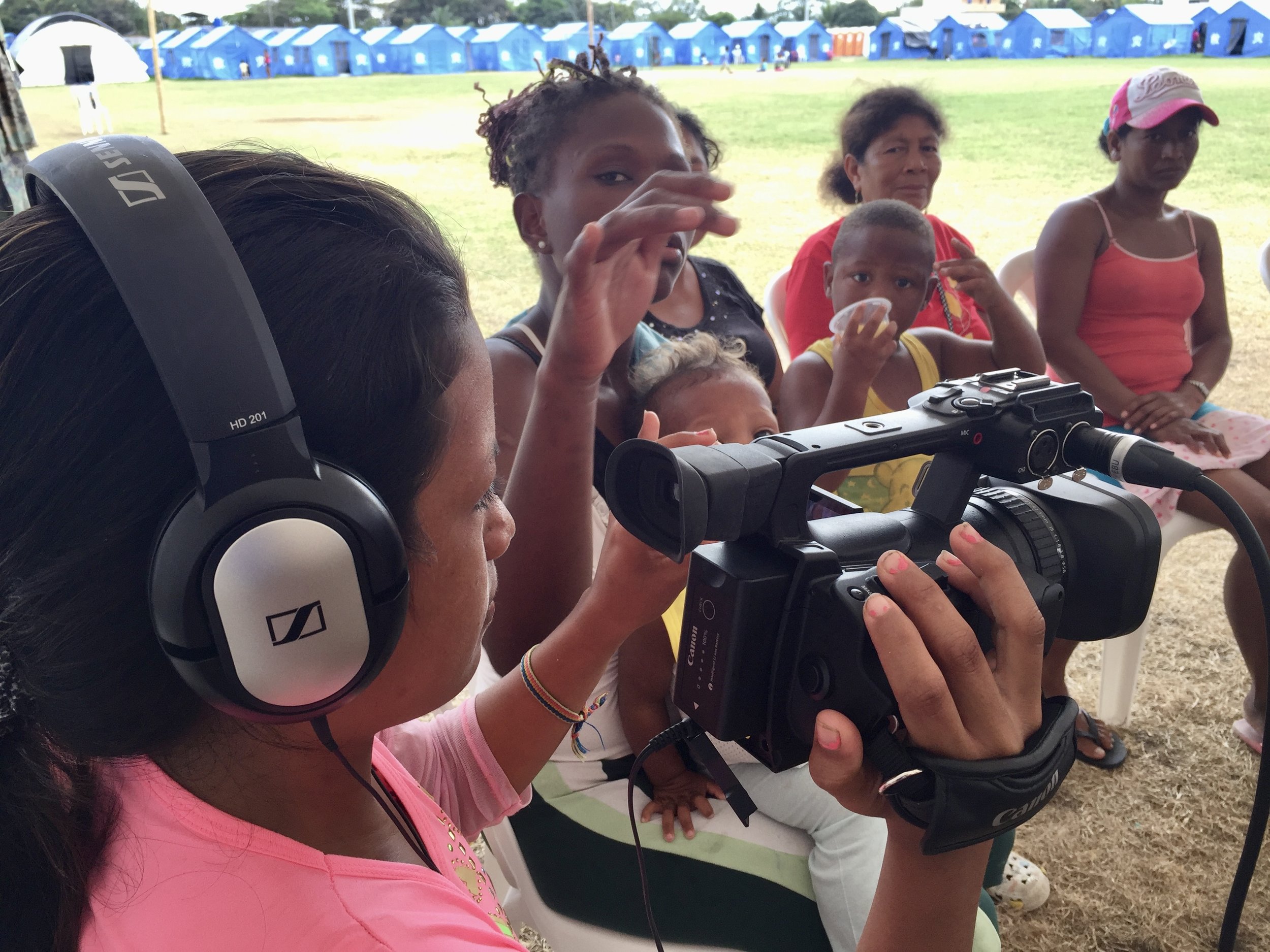 Women at an IDP camp in Ecuador learn how to capture community suggestions addressed to camp managers