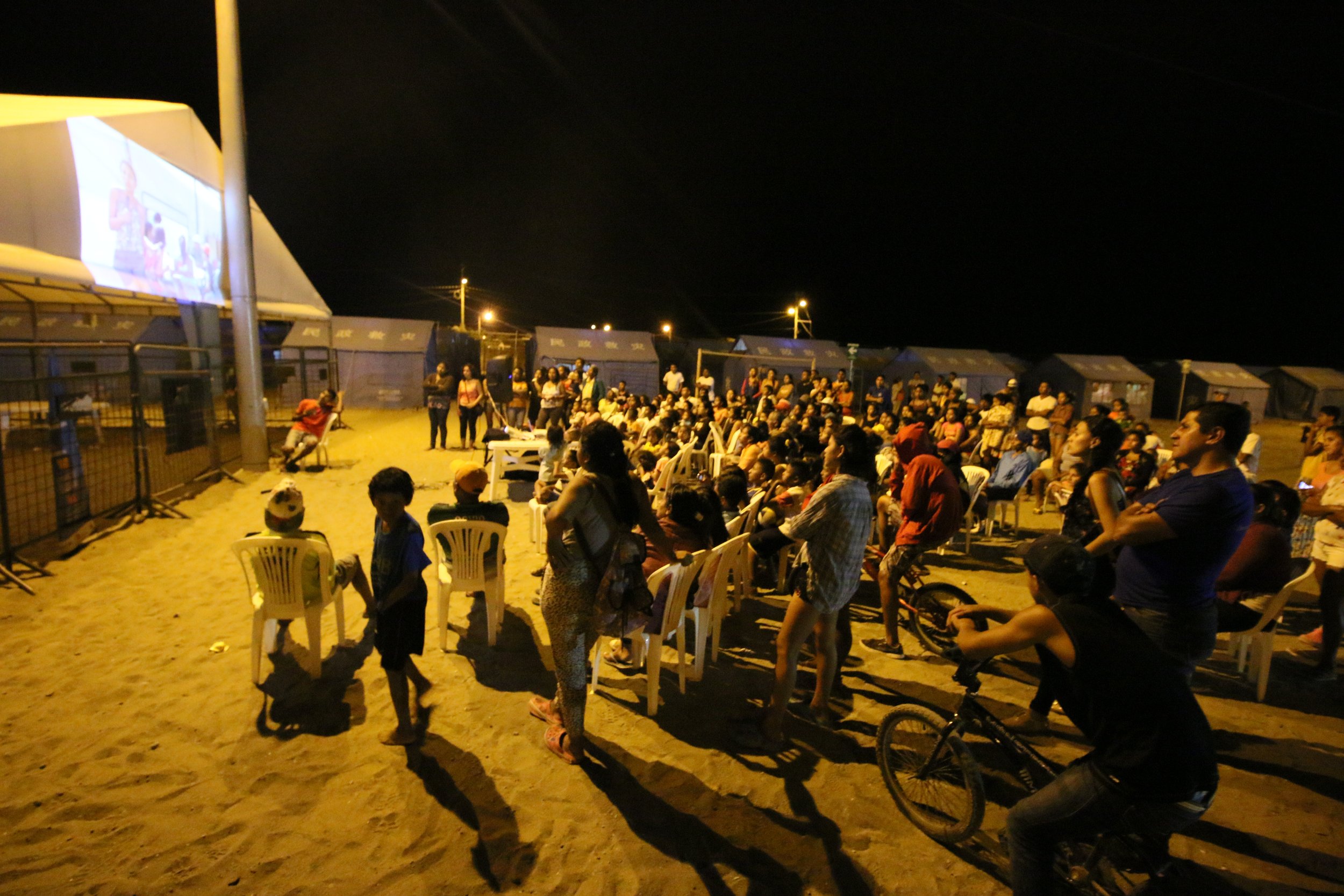 A camp cinema in Ecuador shows community-produced messages aimed at improving life in the camp