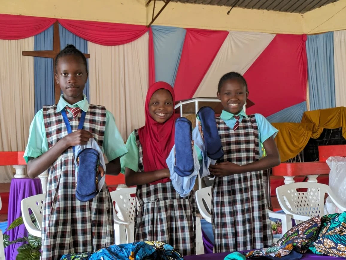 Girls demonstrating pad system (1).jpg