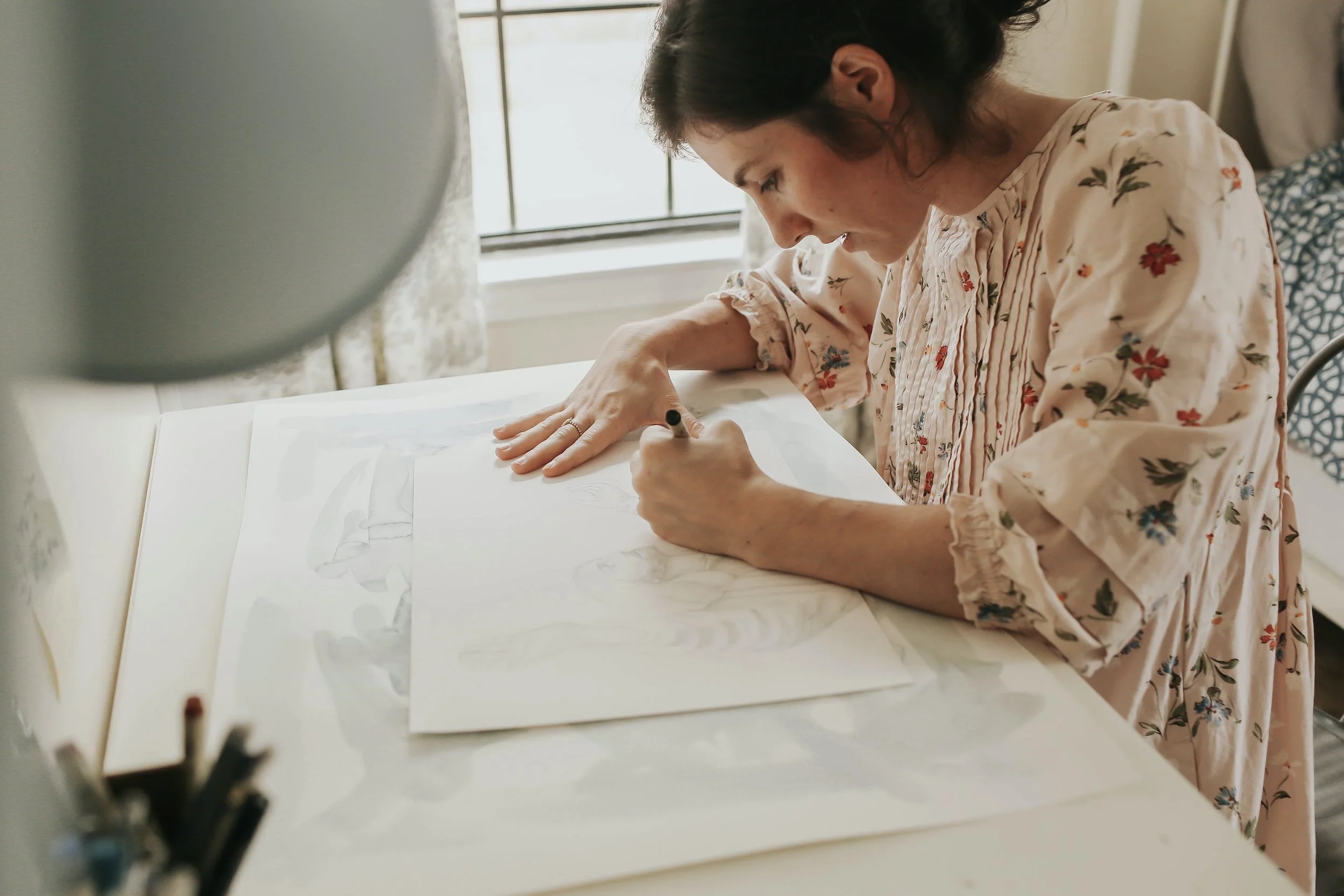 Catholic artist working on an illustration