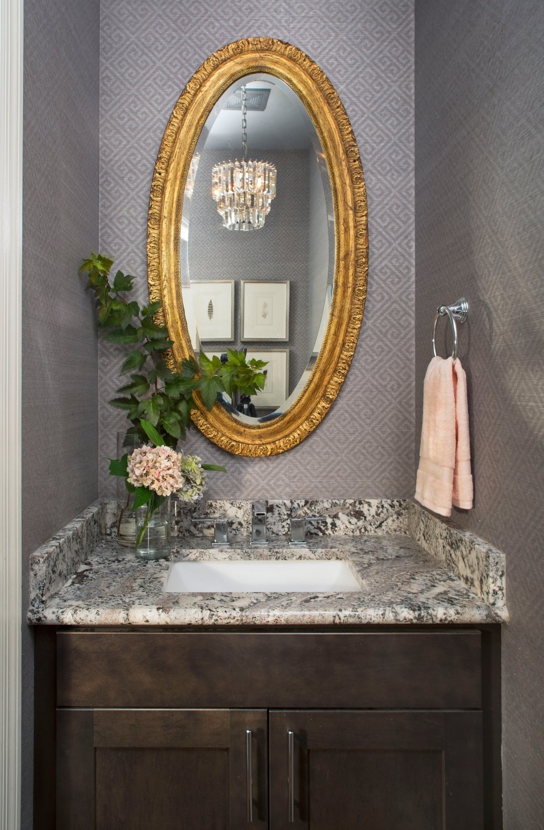 Does your builder grade bath need some love?  I added patterned grasscloth wallpaper, a vintage mirror, and petite crystal chandelier to give this little jewel box a refresh without  remodeling. 

#powderbath #wallpaperedpowderroom #texturedgrassclot