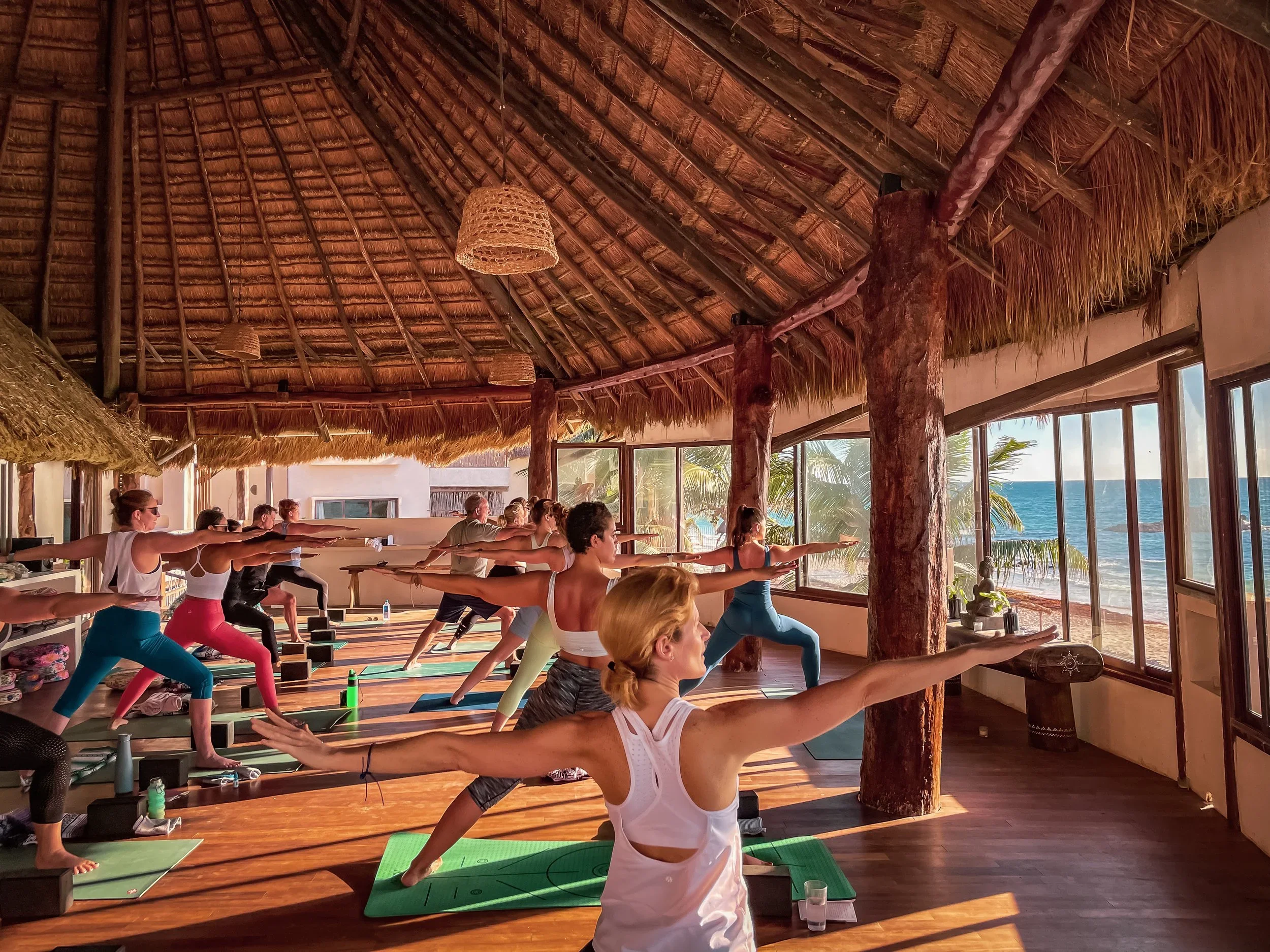 Beachfront yoga and pilates workout at amansala eco chic resort in Tulum, Mexico.