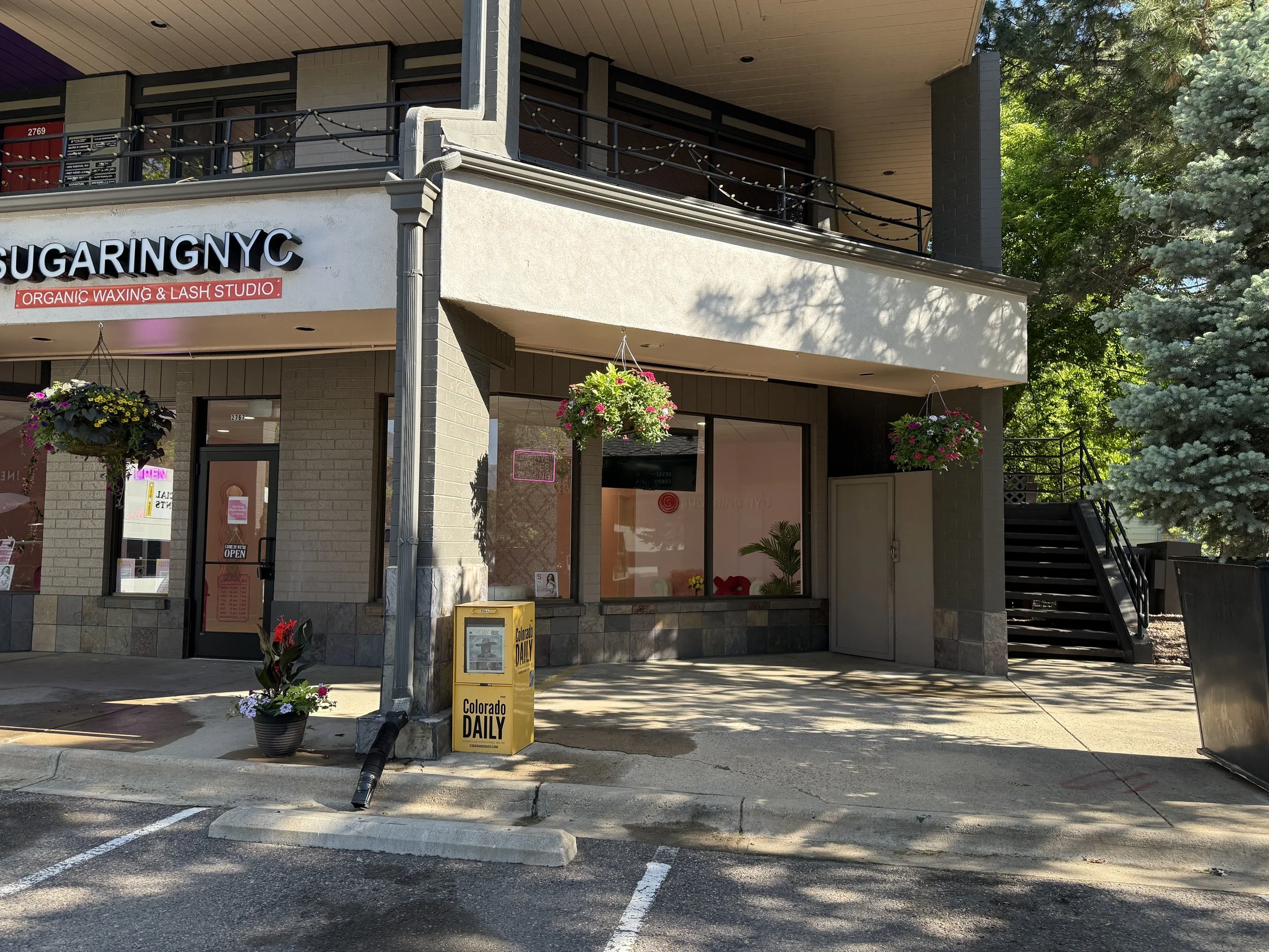 find the outside staircase at the right side of the building, next to the sugaringnyc shop. take that staircase, we are on the second floor.