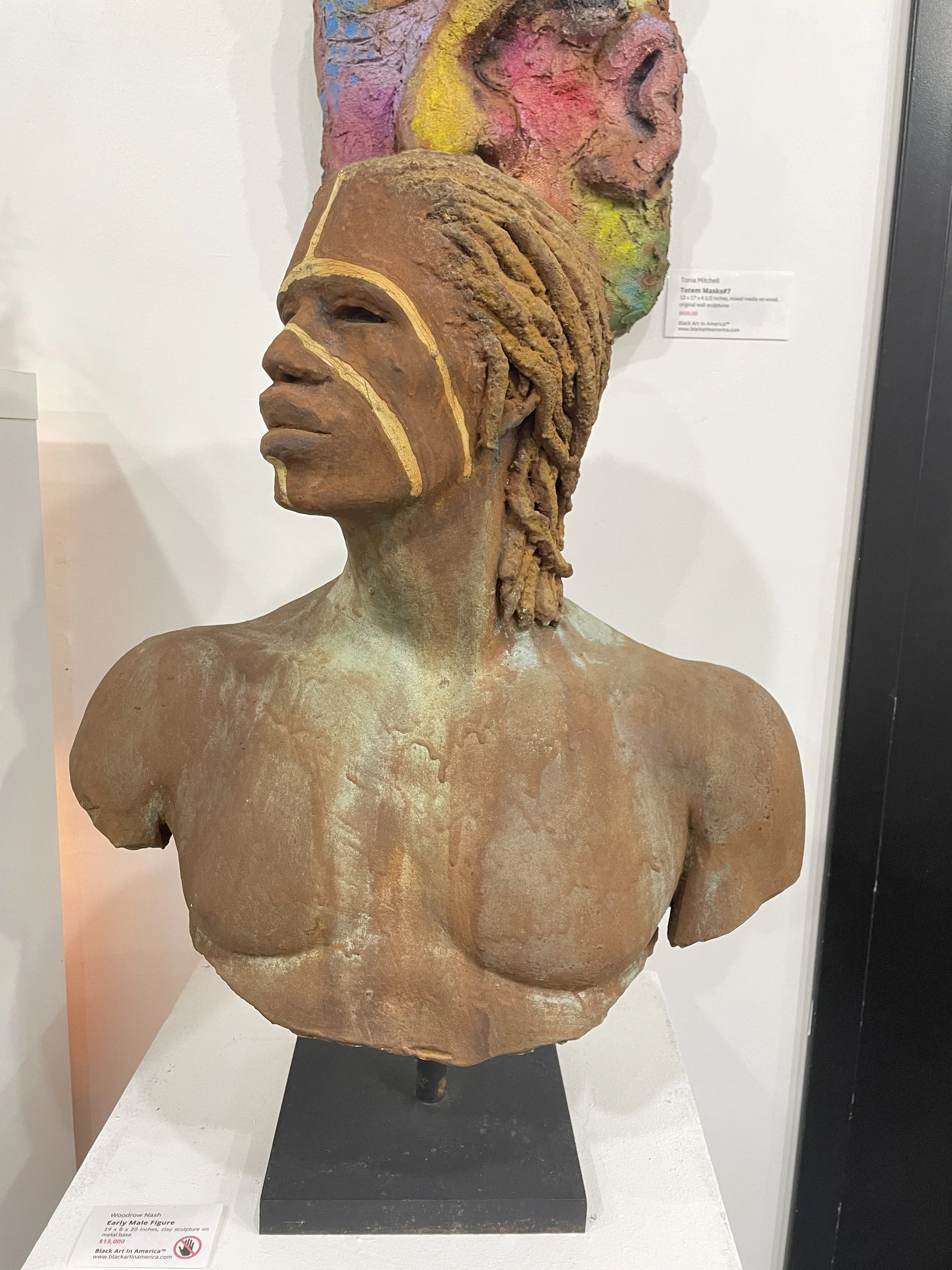 Woodrow Nash, "Early Male Figure," clay on metal base, 19 x 8 x20 in.
