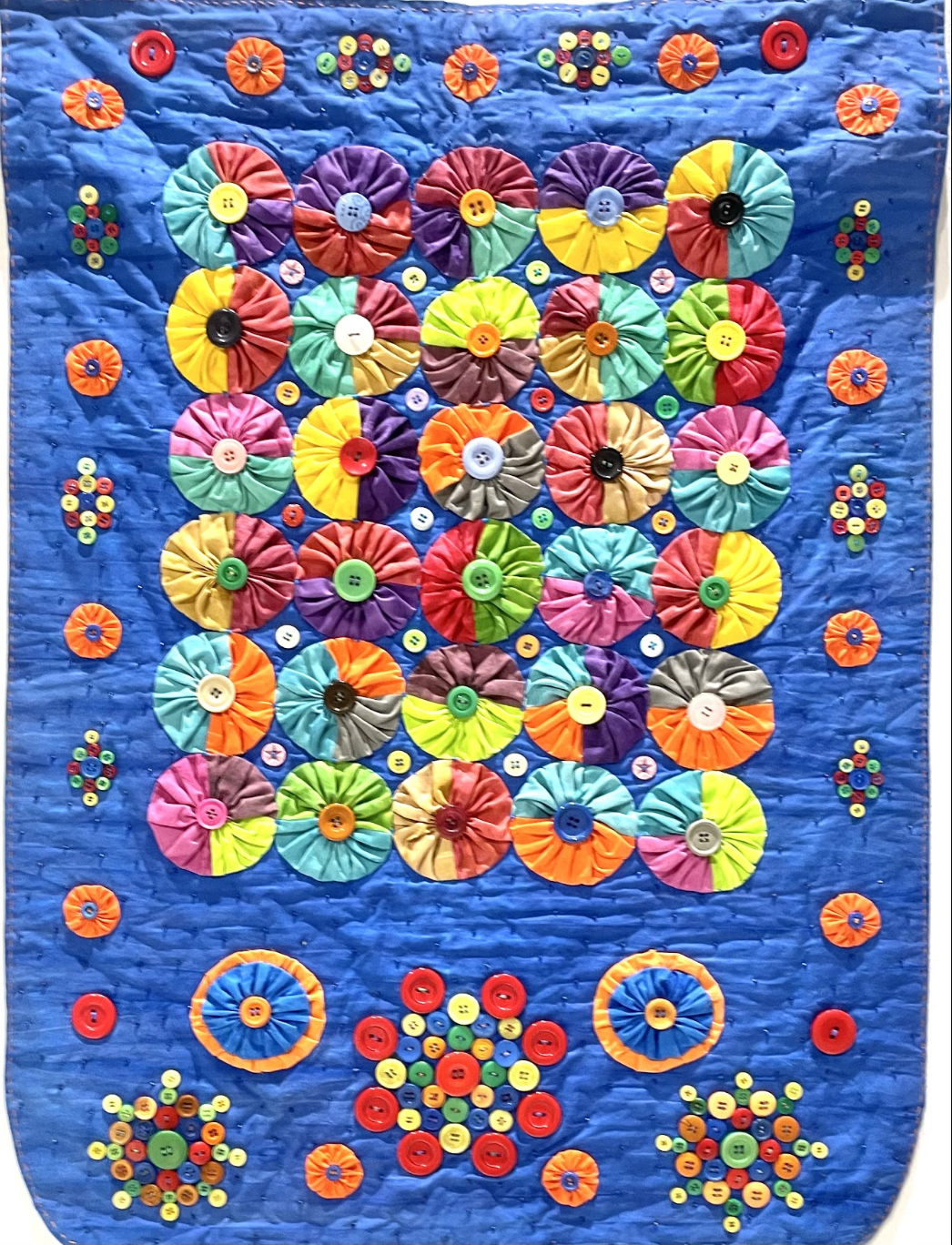 Yo-Yo Kaleidoscope, 2021. Hand-dyed and hand-quilted.