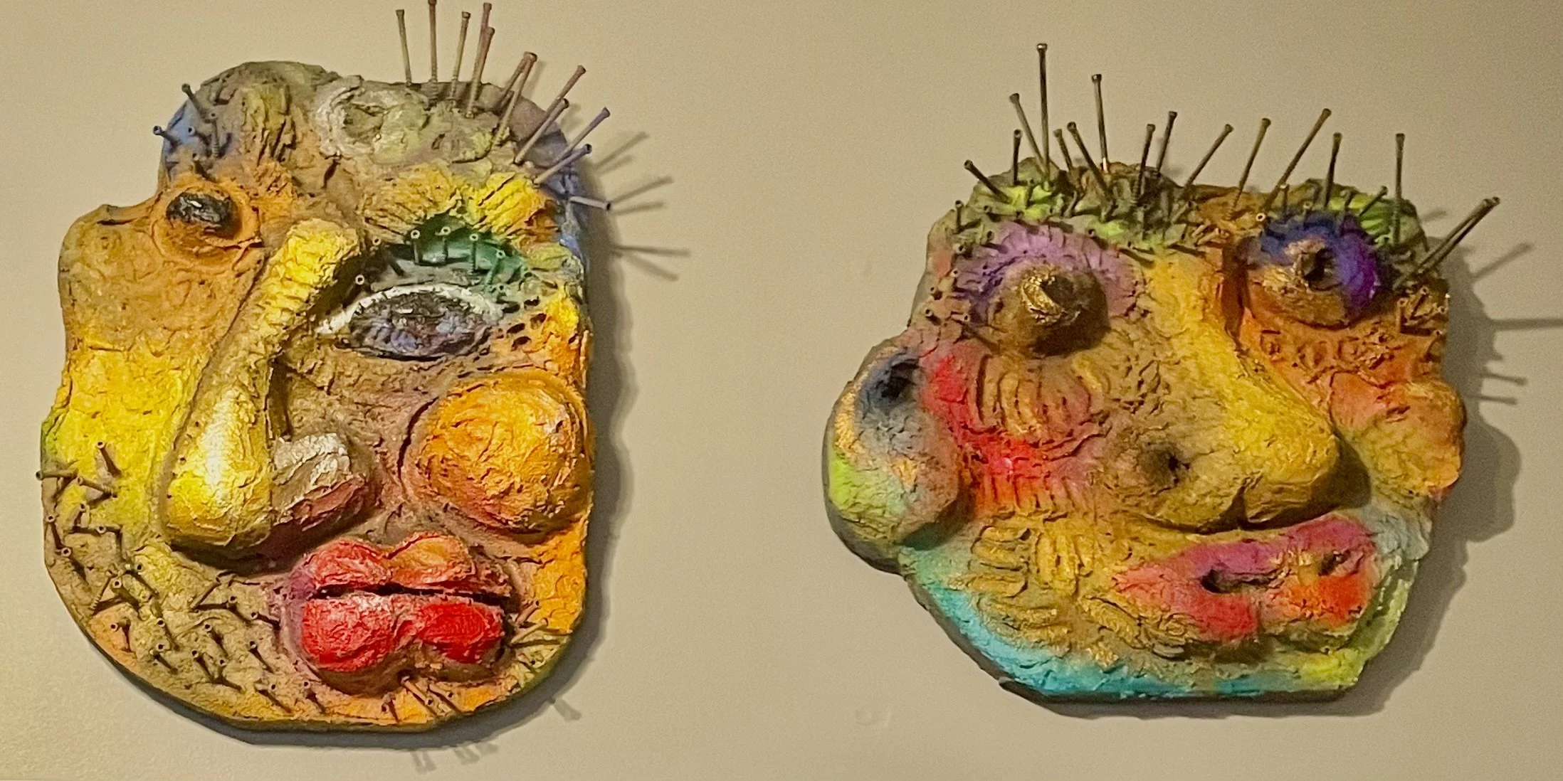 Tonia Mitchell, :Totem Masks, #1 and #2, mixed media on wood, 12 x 16 x 3 in.