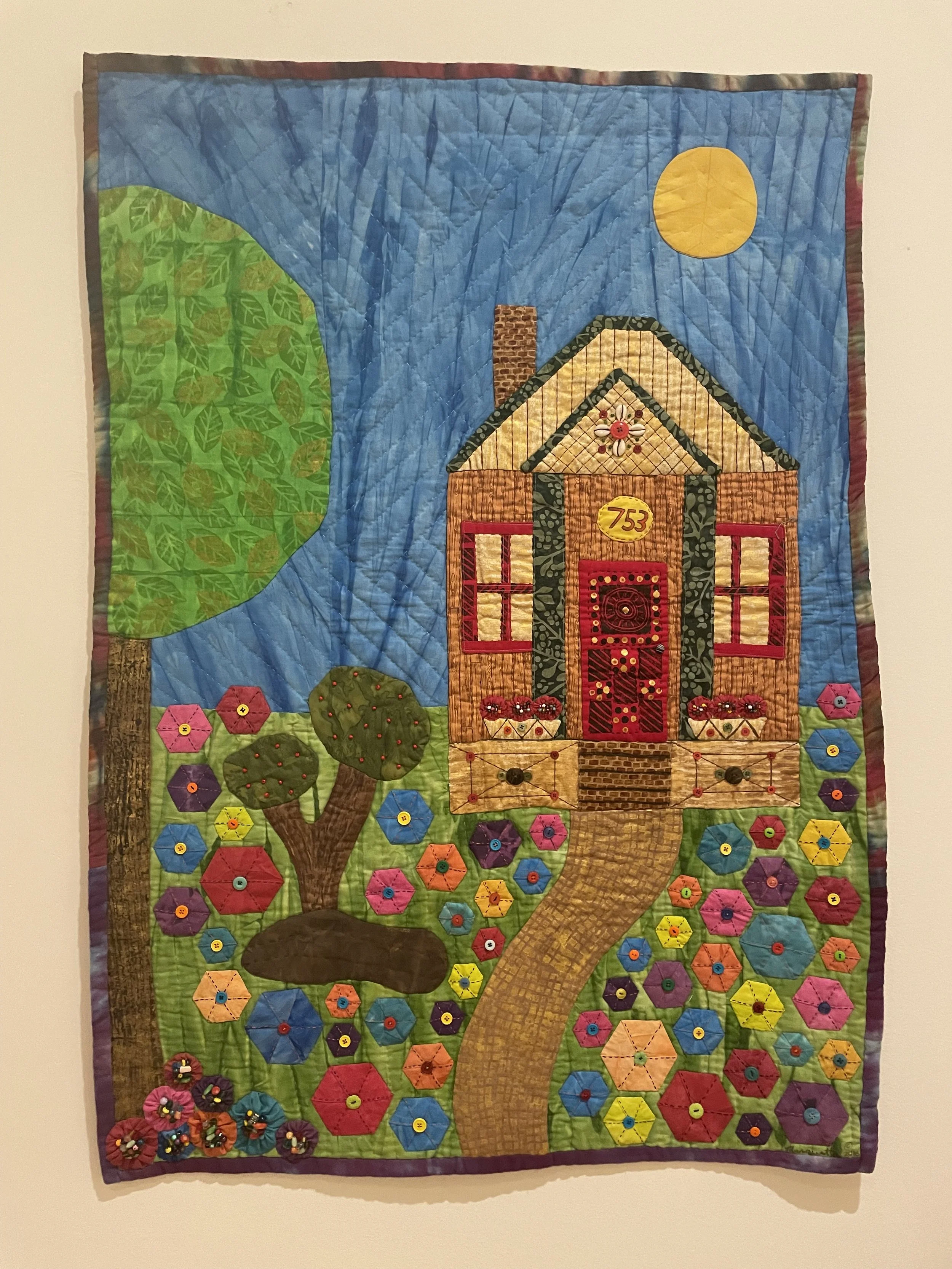 Marquetta Johnson, Tiny House Quilt. 2017. Hand-dyed, hand-painted cotton fabric with buttons, beads, and cowrie shells.