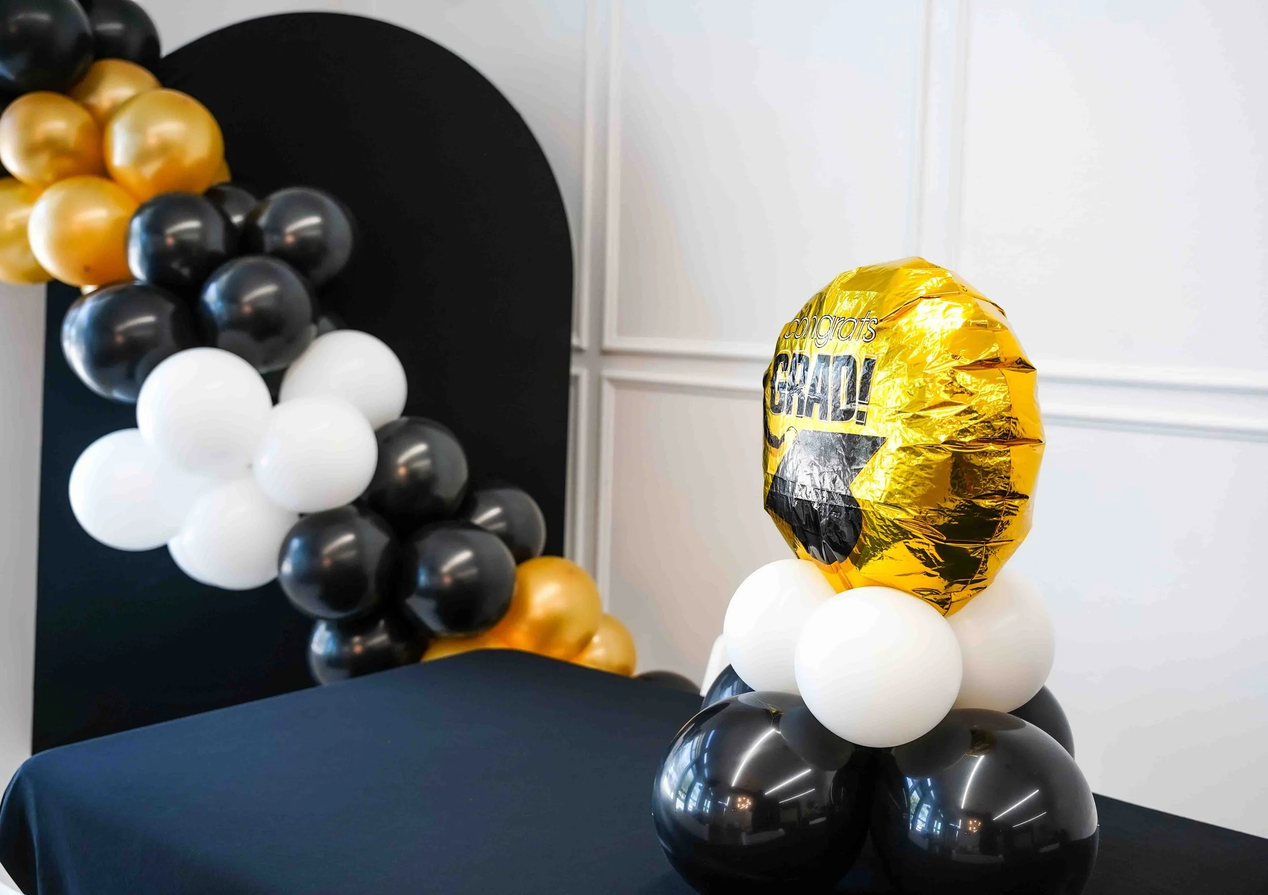 Graduation party set up, Intimate event venue in North Dallas with table setup for small gatherings and celebrations near Farmers Branch and Plano. This image showcases our modern event venue located in North Dallas, available for rent for intimate g