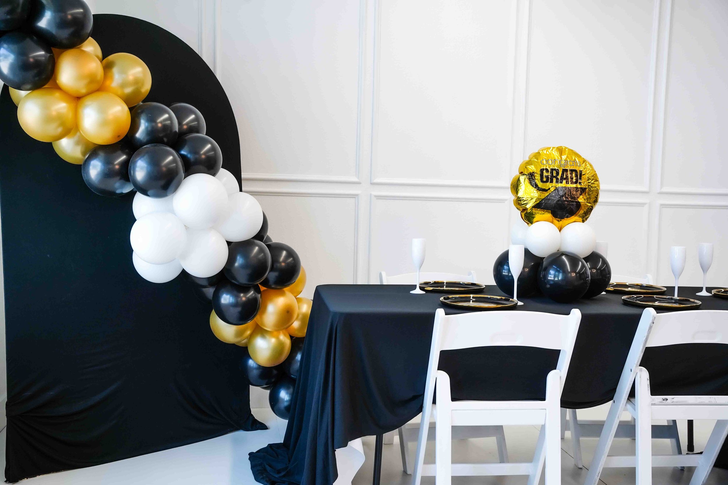 Graduation party set up, Intimate event venue in North Dallas with table setup for small gatherings and celebrations near Farmers Branch and Plano. This image showcases our modern event venue located in North Dallas, available for rent for intimate g