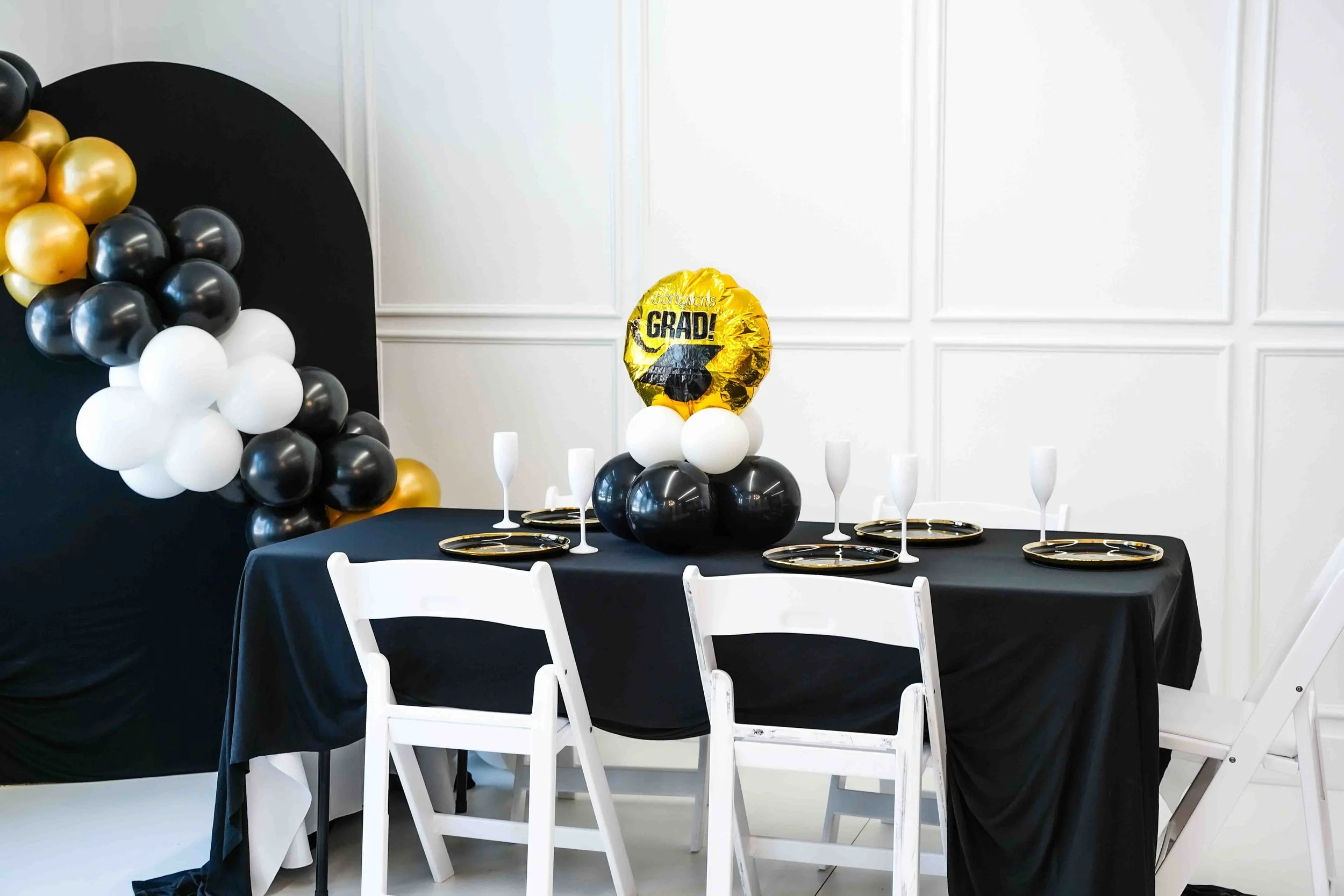 Graduation party set up, Intimate event venue in North Dallas with table setup for small gatherings and celebrations near Farmers Branch and Plano. This image showcases our modern event venue located in North Dallas, available for rent for intimate g