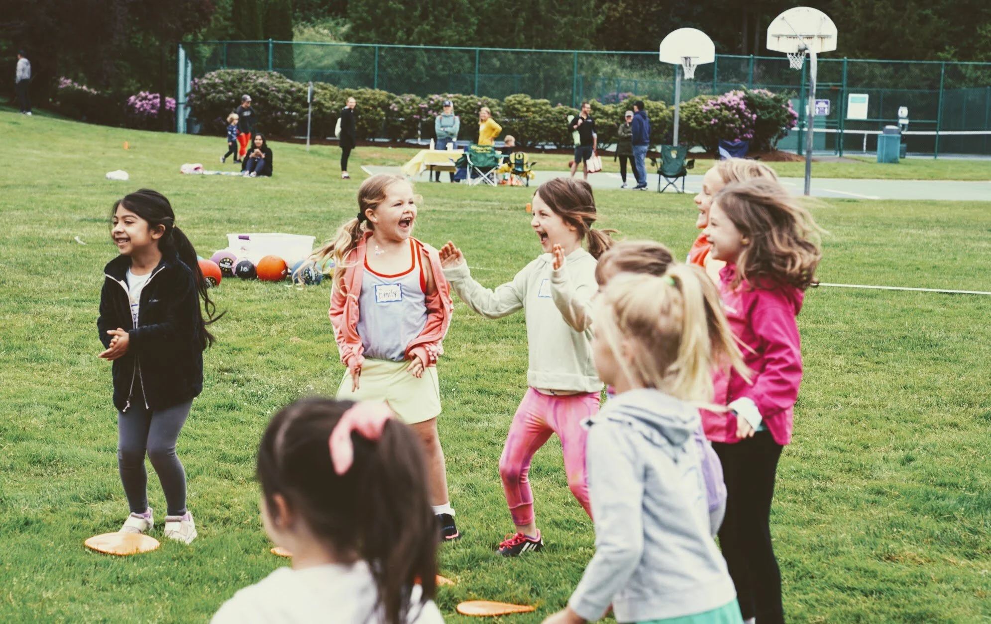 Girls learning football skills at Girls Sports Club clinic