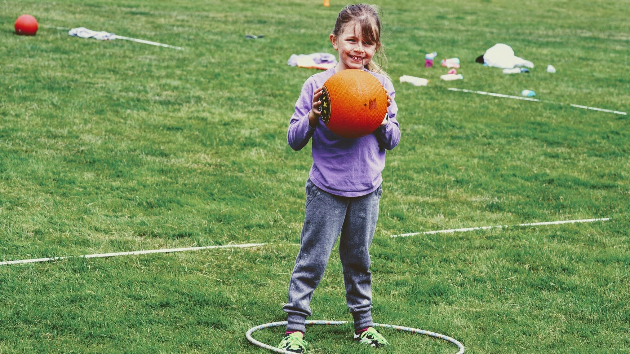 Girls learning sports skills at Girls Sports Club clinic