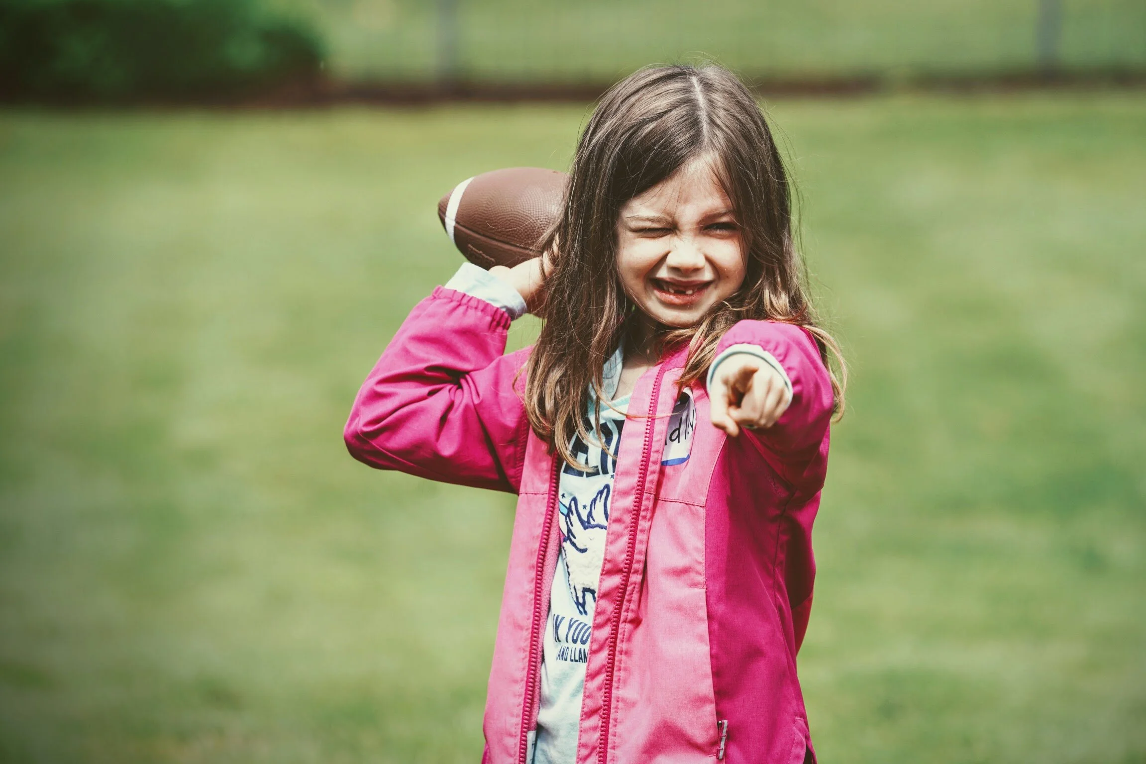 Girls learning football skills at Girls Sports Club clinic