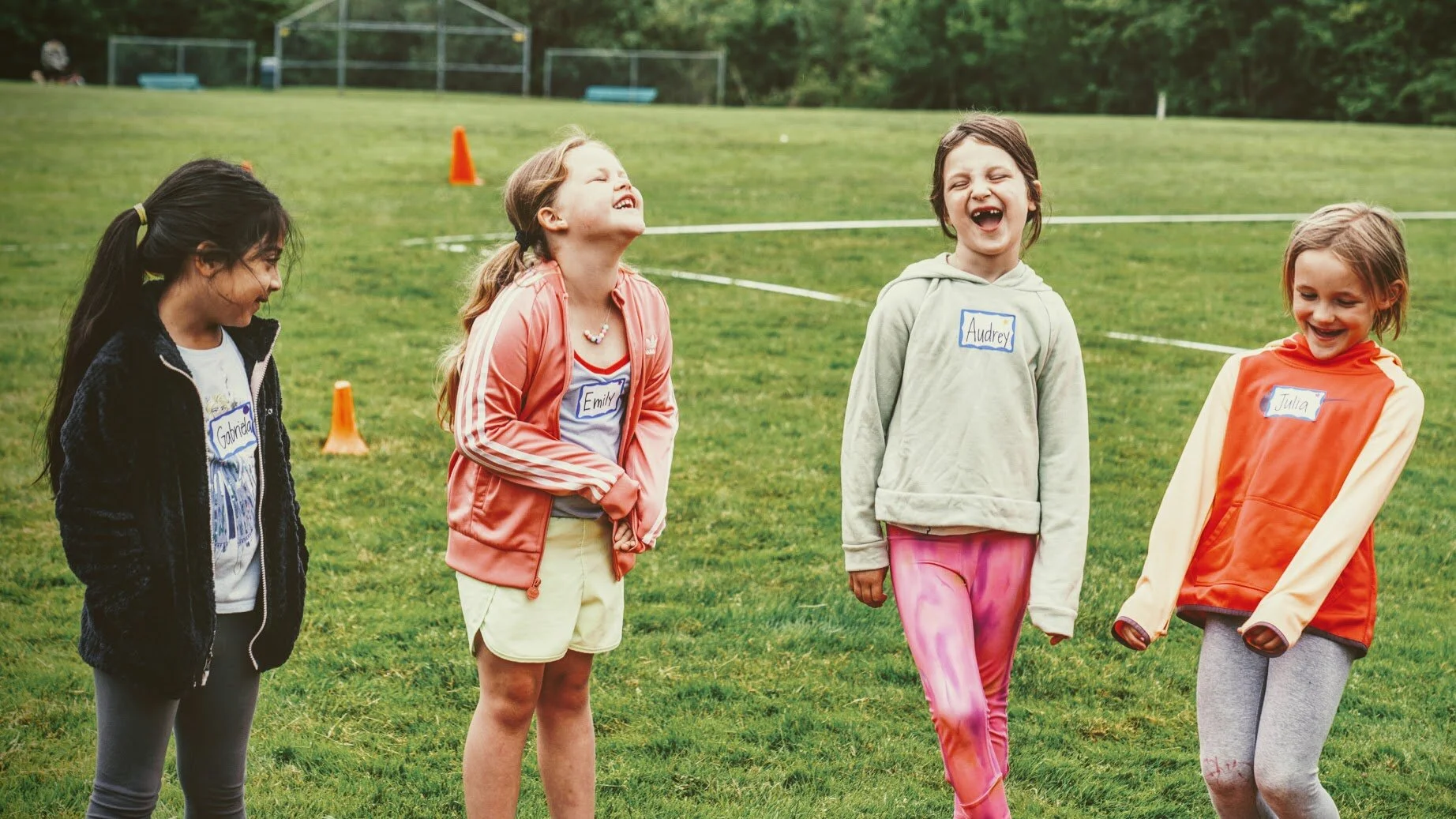 Girls learning football skills at Girls Sports Club clinic